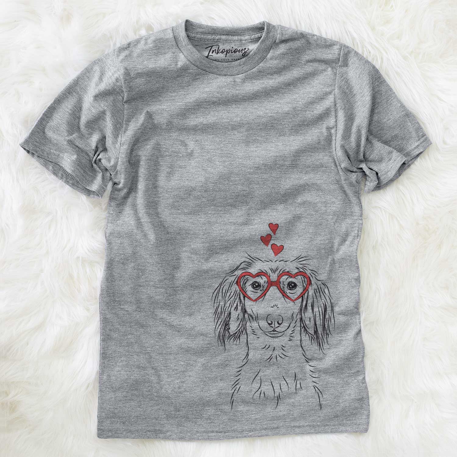 Hand-drawn sketch of Roux the Long Haired Dachshund wearing heart-shaped glasses on a Grey Unisex crewneck