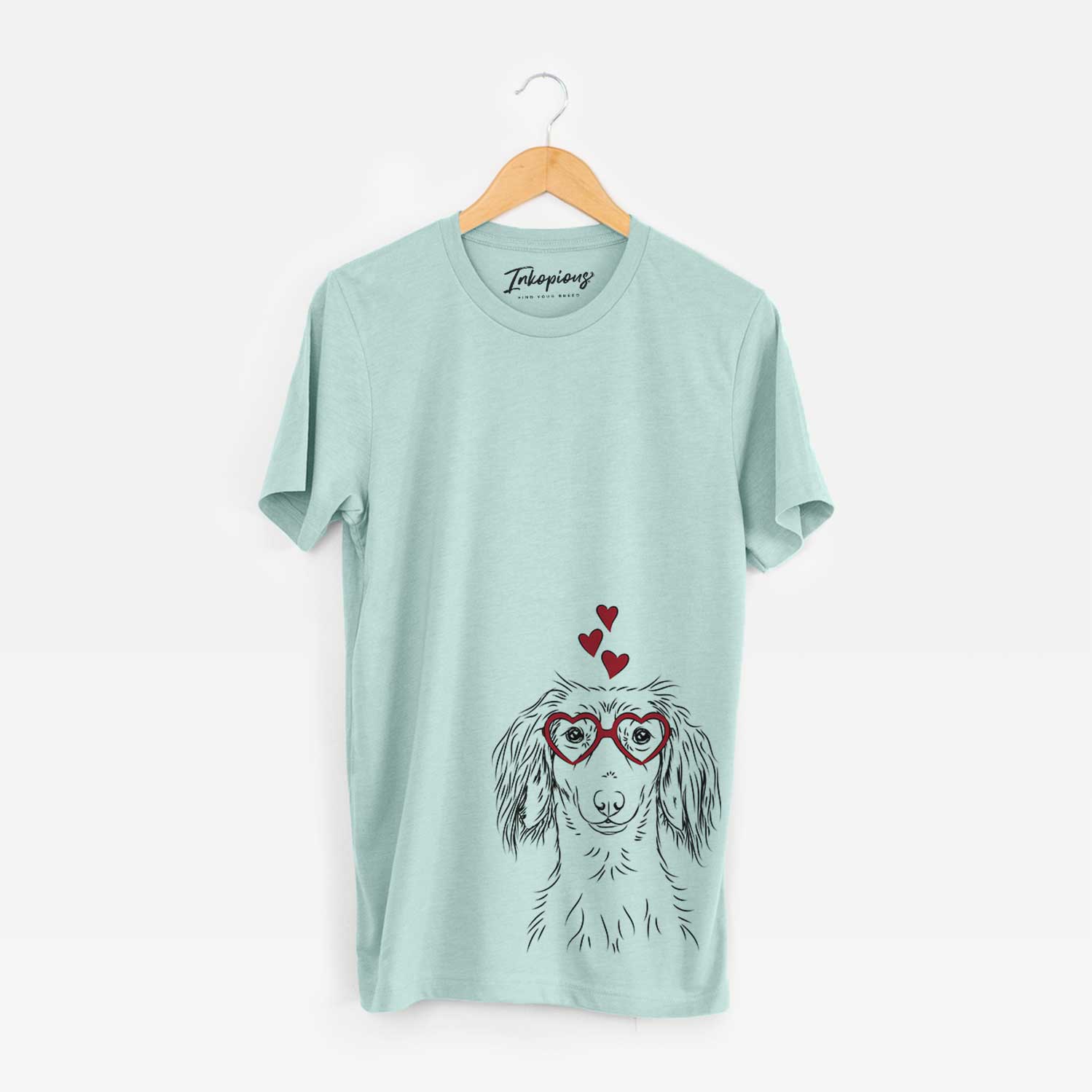 Hand-drawn sketch of Roux the Long Haired Dachshund wearing heart-shaped glasses on a Heather Sage Bella Canvas Unisex Crewneck