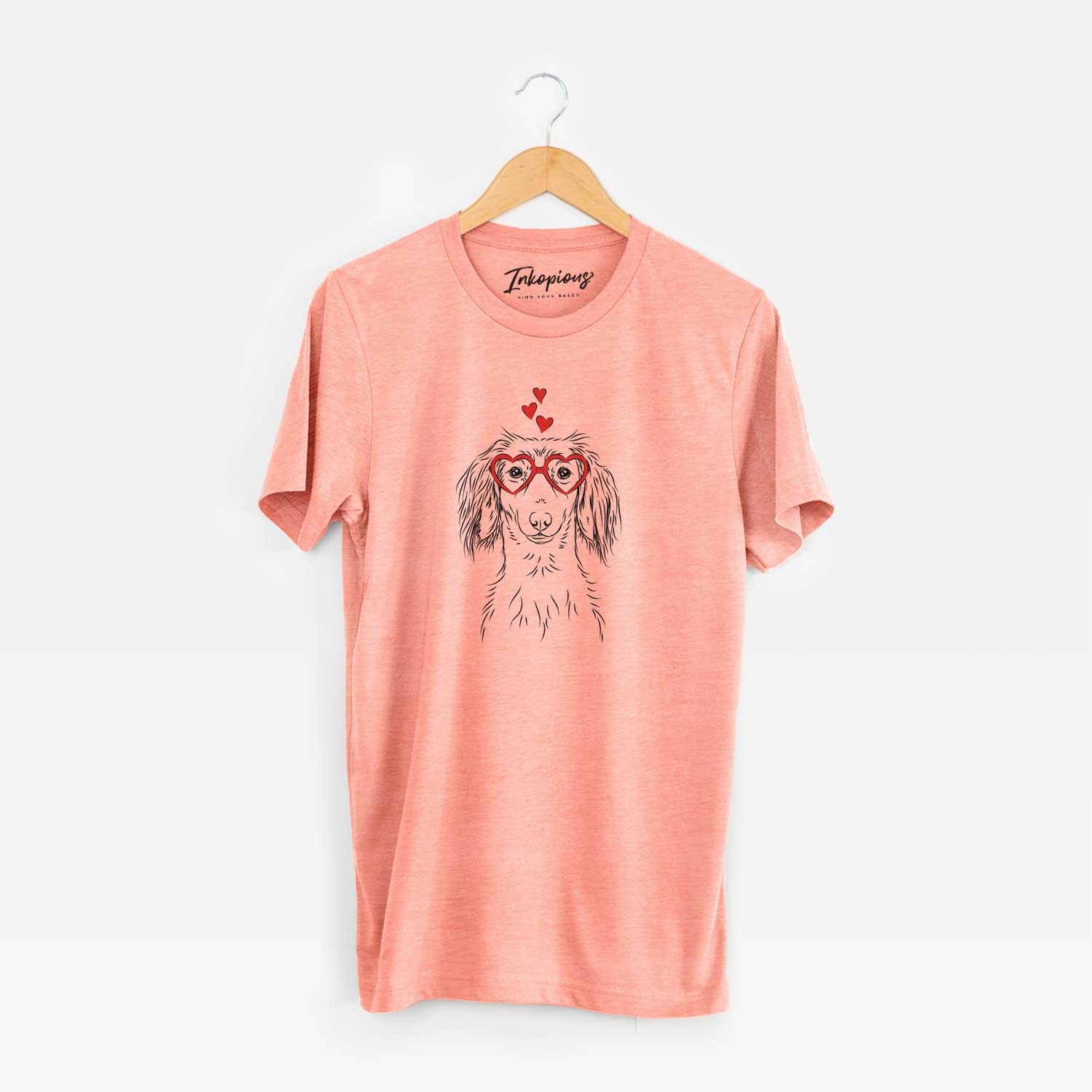 Hand-drawn sketch of Roux the Long Haired Dachshund wearing heart-shaped glasses on a Sunset Unisex crewneck