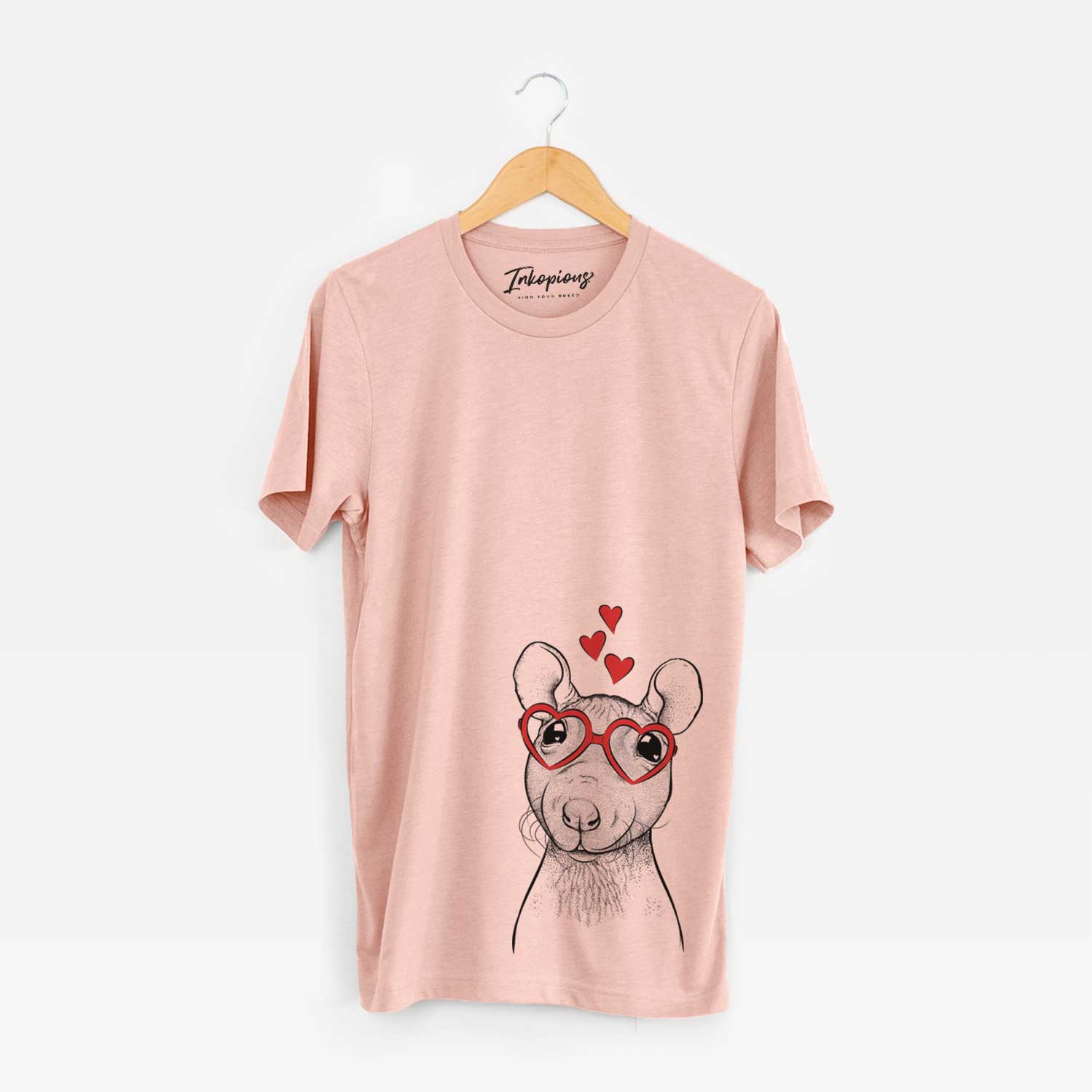 Hand-drawn sketch of Ruthie the Hairless Rat wearing heart-shaped glasses on a Peach Unisex crewneck