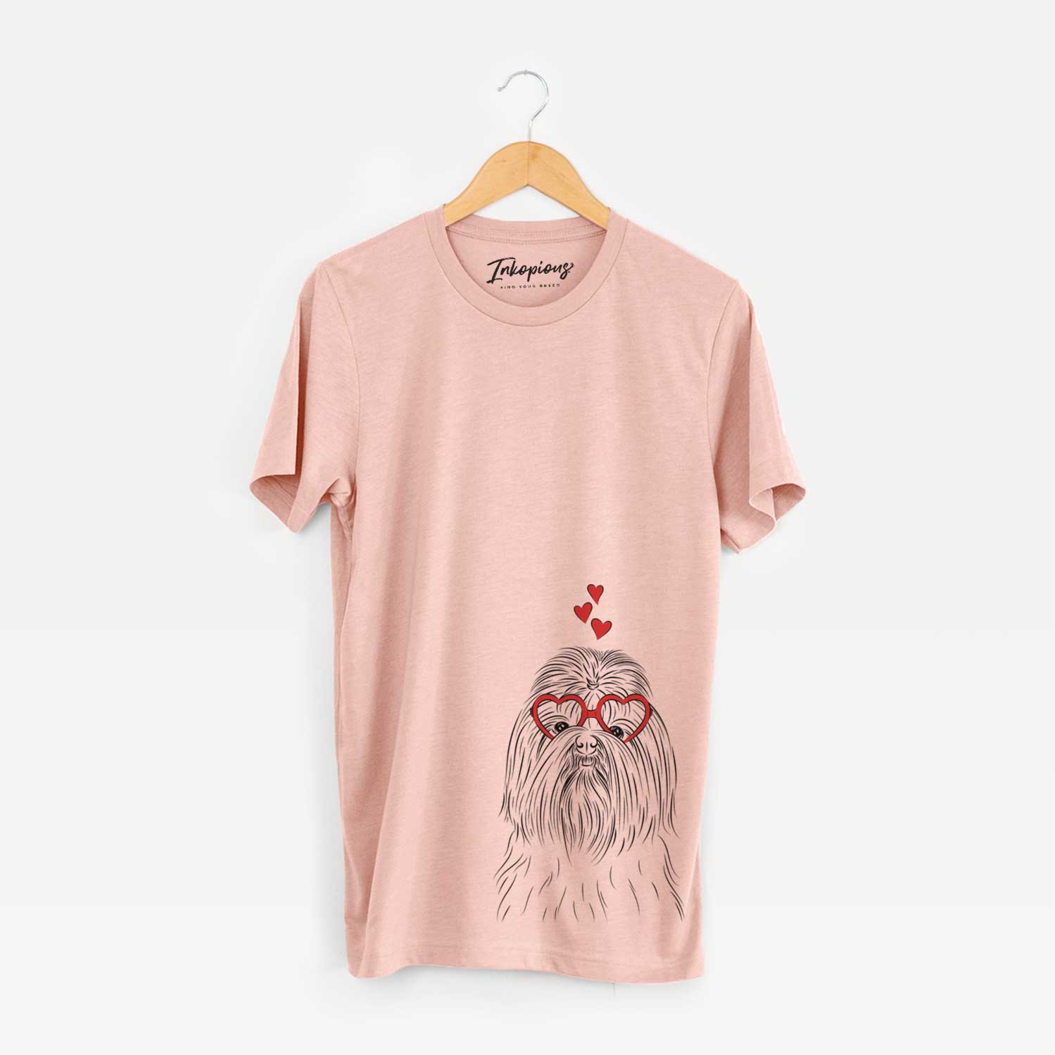 Hand-drawn sketch of Sabine the Shih Tzu wearing heart-shaped glasses on a Peach Unisex crewneck