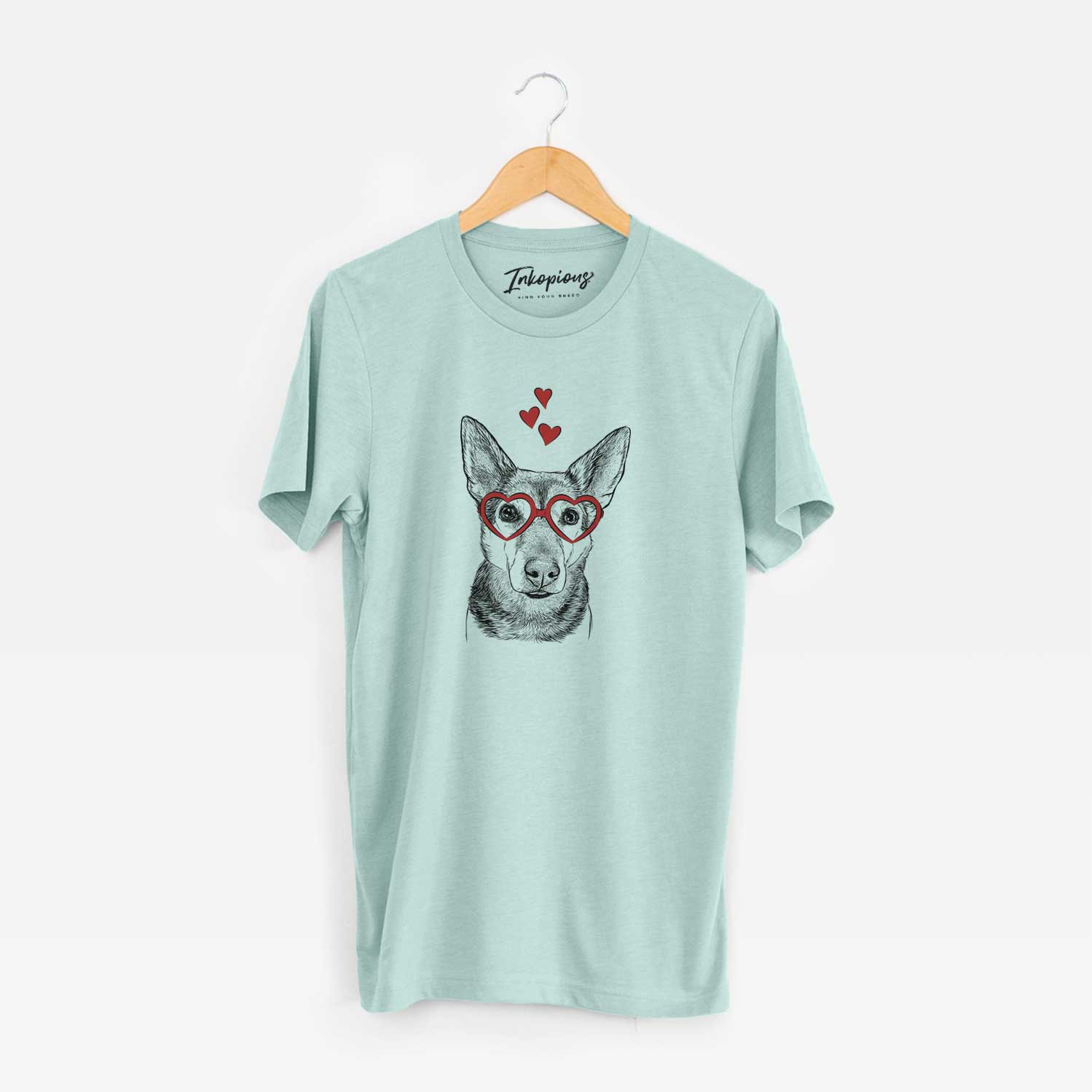 Hand-drawn sketch of Sammie the Mixed Breed wearing heart-shaped glasses on a Heather Sage Unisex crewneck