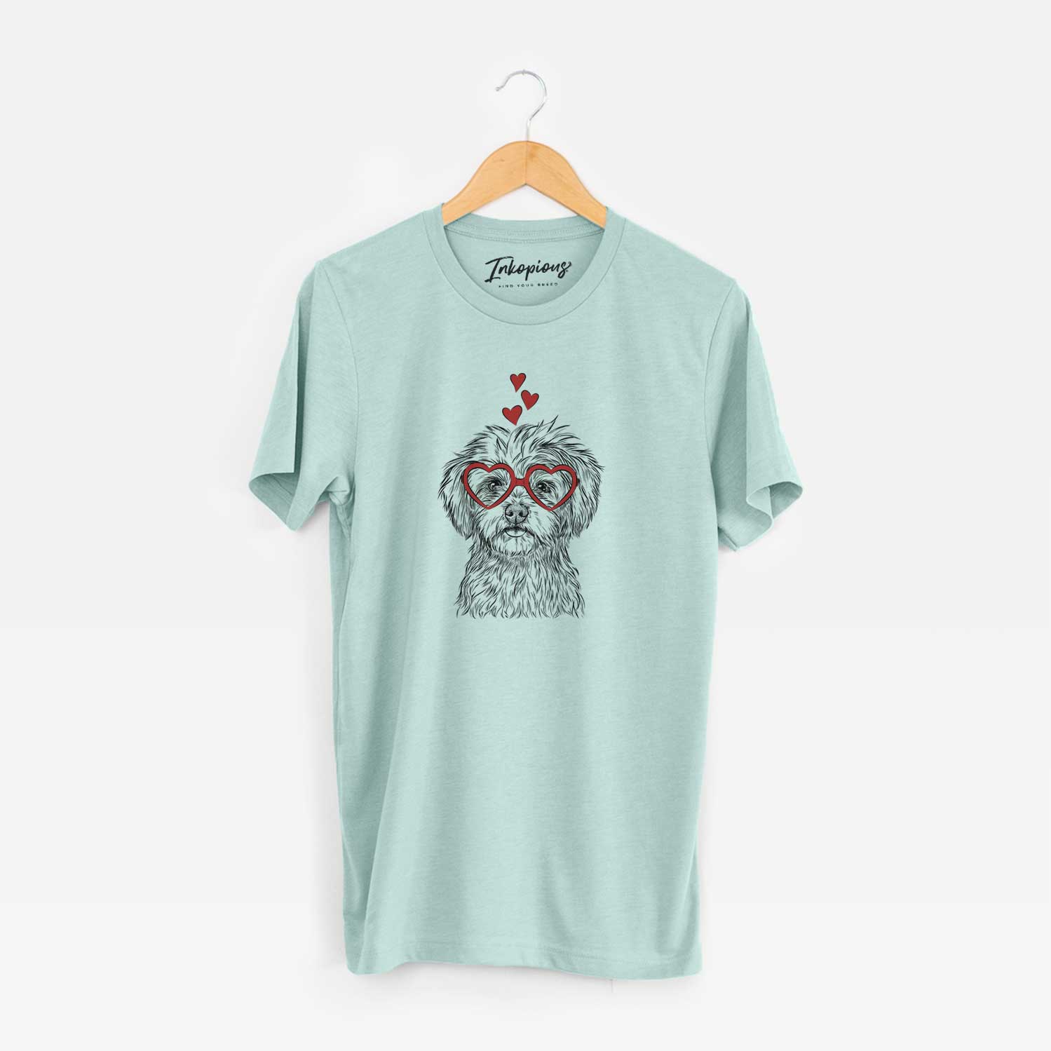 Hand-drawn sketch of Sammy the Shorkie wearing heart-shaped glasses on a Heather Sage Unisex crewneck