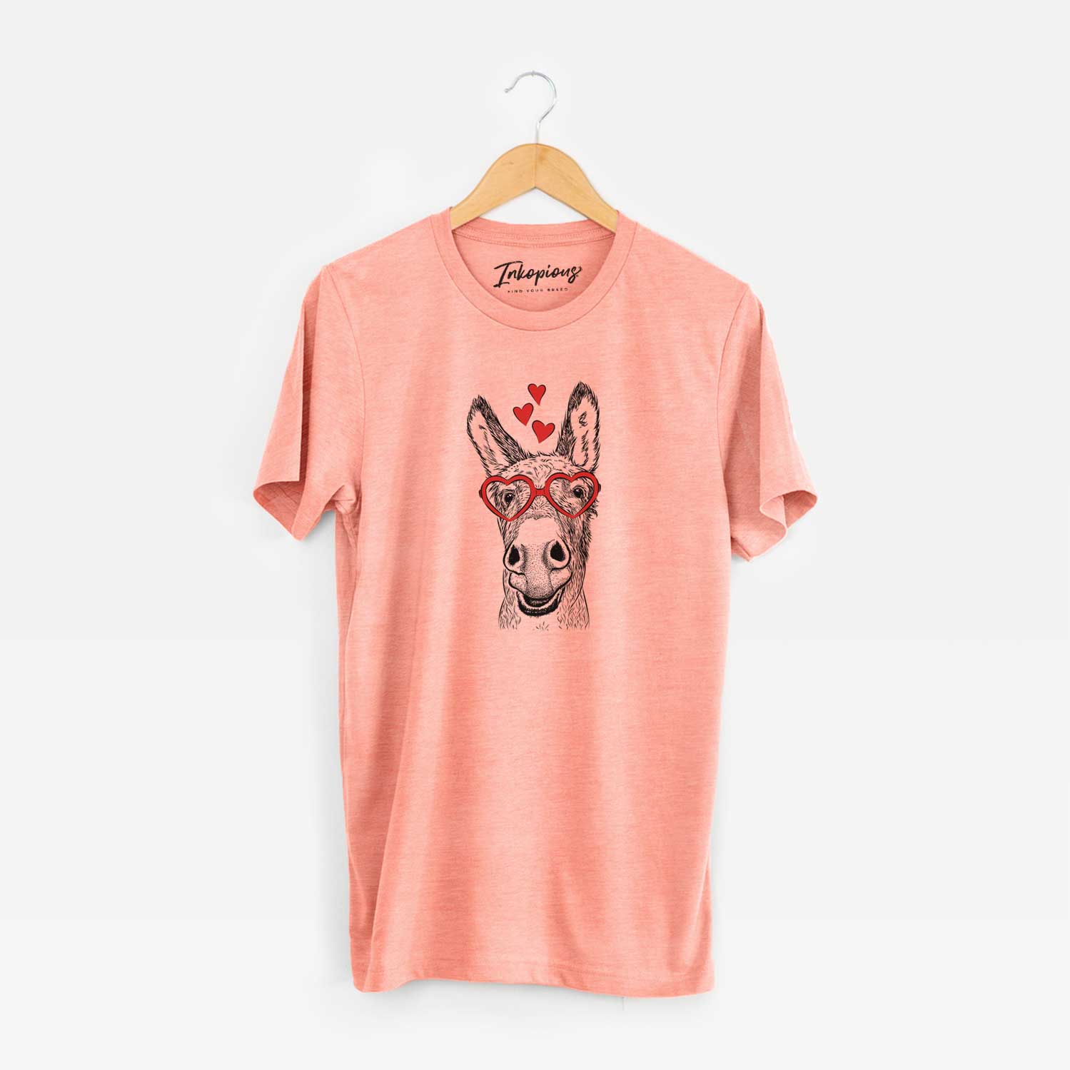 Hand-drawn sketch of Samule the Donkey wearing heart-shaped glasses on a Sunset Unisex crewneck