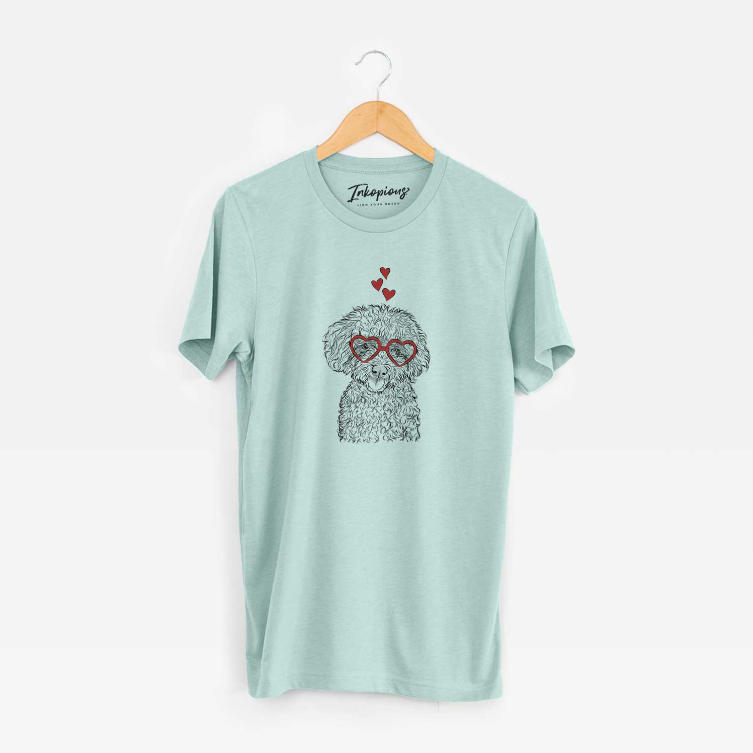 Hand-drawn sketch of Satsu the Micro Teacup Poodle wearing heart-shaped glasses on a Heather Sage Unisex crewneck