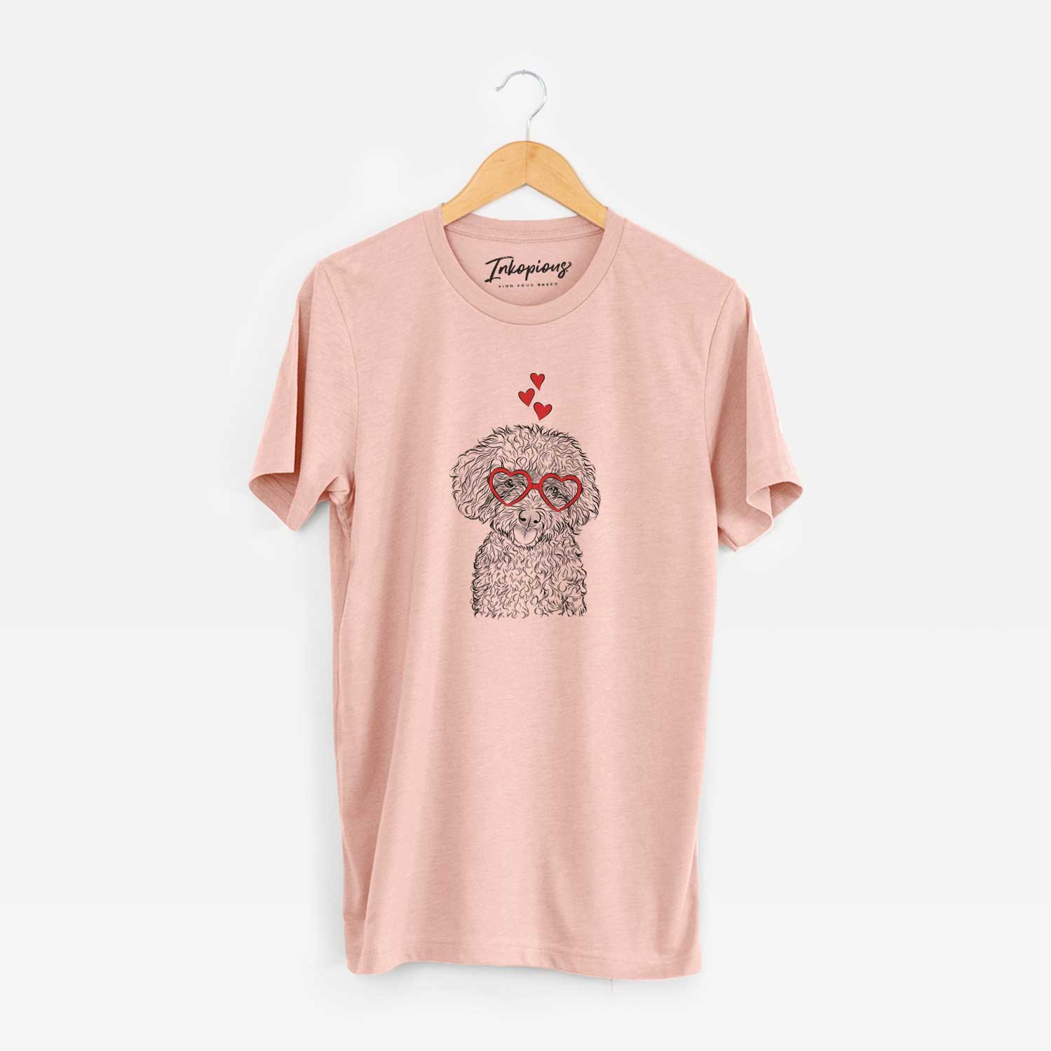 Hand-drawn sketch of Satsu the Micro Teacup Poodle wearing heart-shaped glasses on a Peach Unisex crewneck