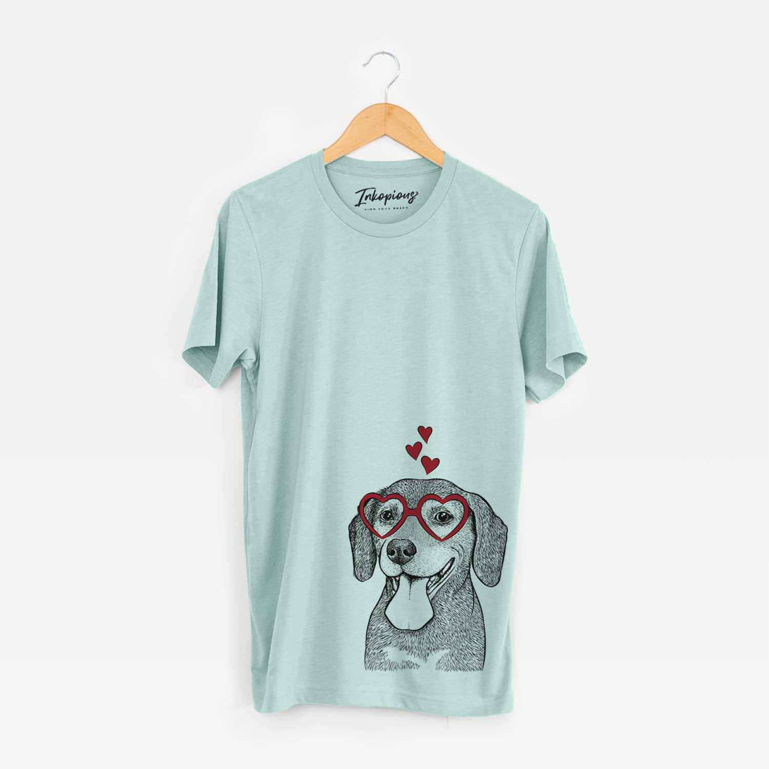 Hand-drawn sketch of Scarlett the Beagle wearing heart-shaped glasses on a Heather Sage Bella Canvas Unisex Crewneck