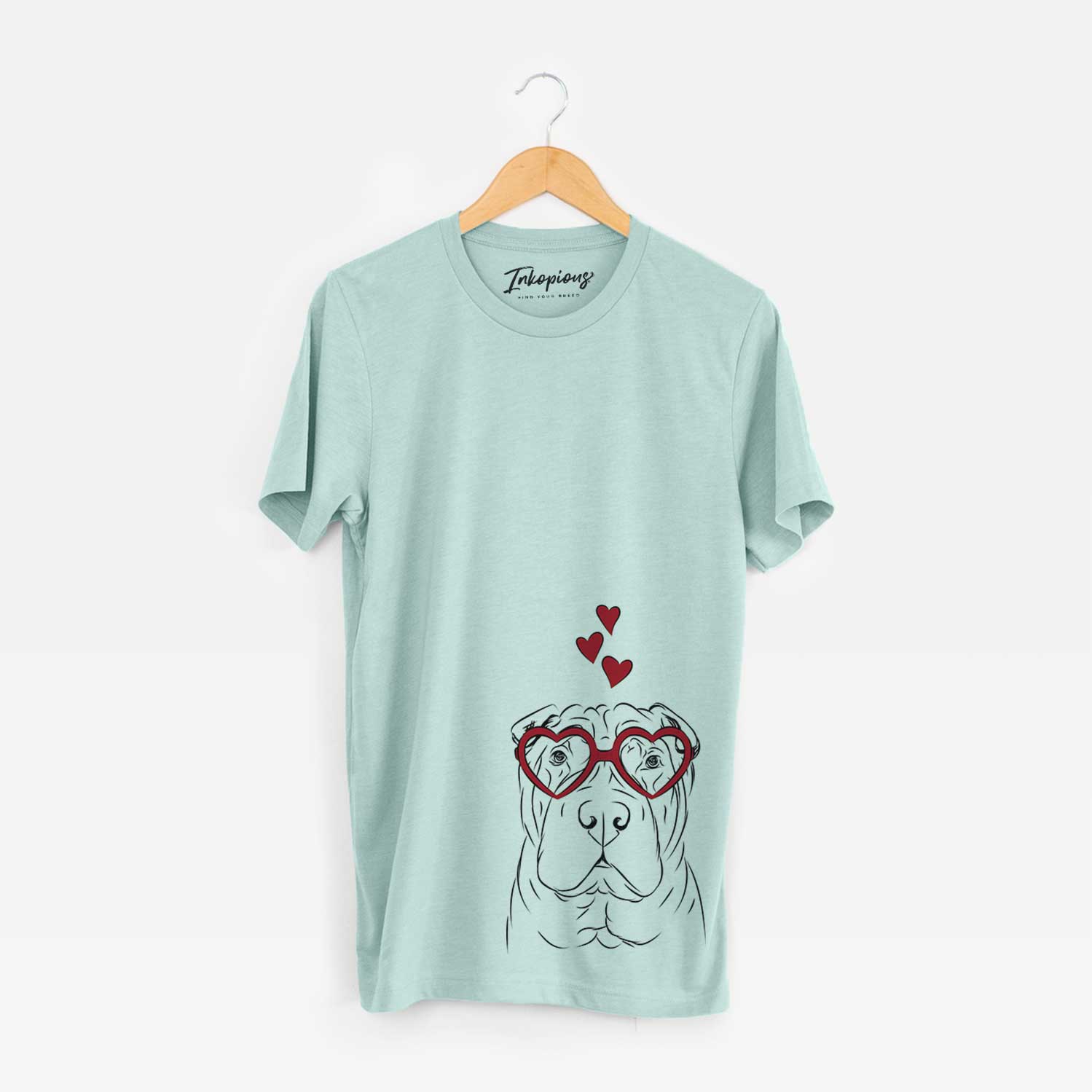 Hand-drawn sketch of Sharpy the Shar Pei wearing heart-shaped glasses on a Heather Sage Bella Canvas Unisex Crewneck