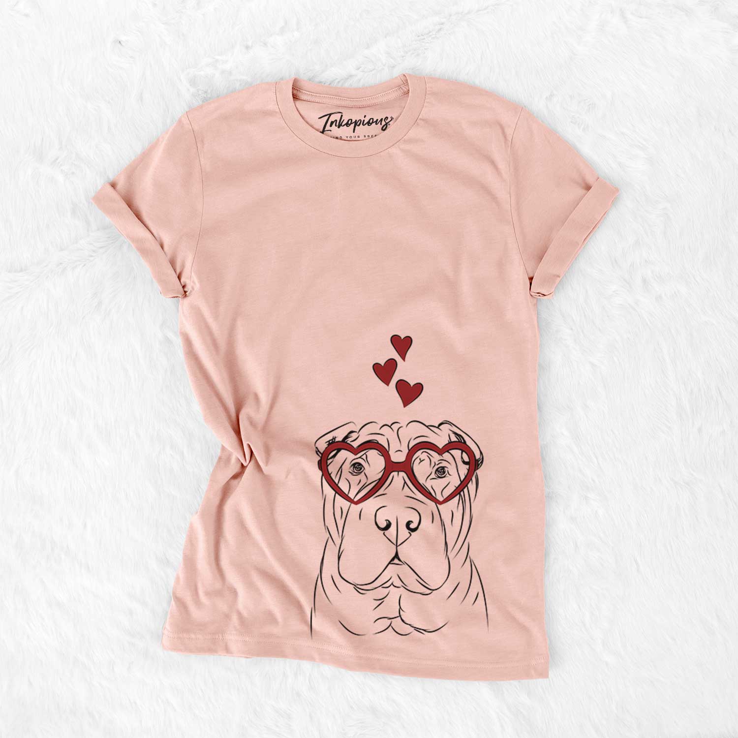 Hand-drawn sketch of Sharpy the Shar Pei wearing heart-shaped glasses on a Peach Bella Canvas Unisex Crewneck