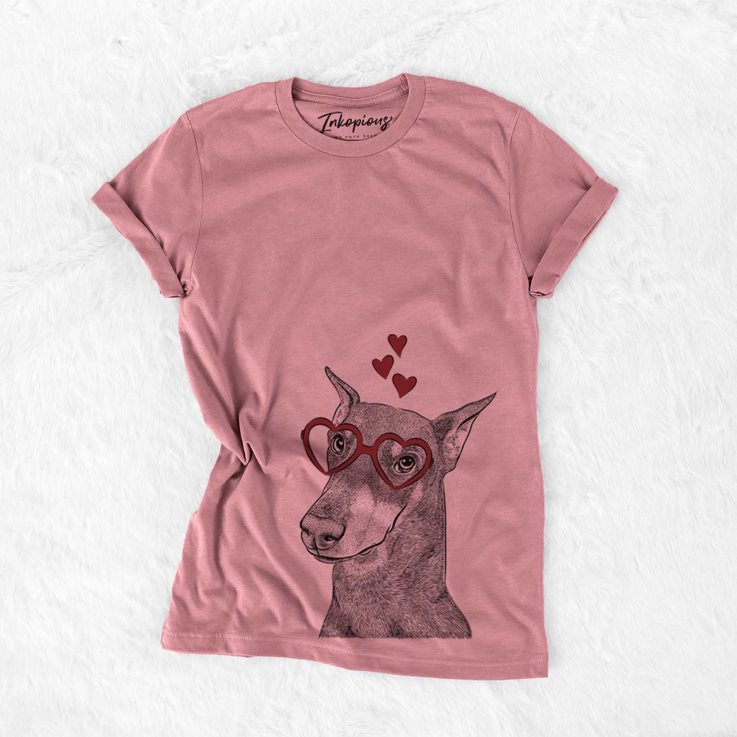Hand-drawn sketch of Shelby the Doberman Pinscher wearing heart-shaped glasses on a Mauve Bella Canvas Unisex Crewneck