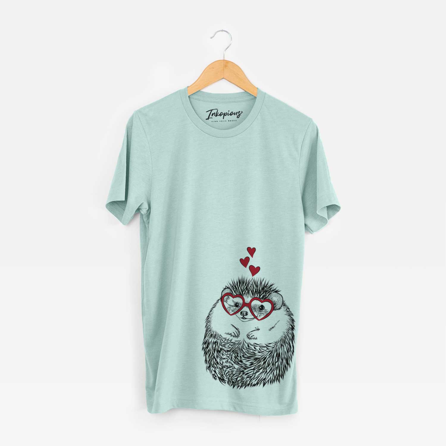 Hand-drawn sketch of Sid the Hedgehog wearing heart-shaped glasses on a Heather Sage Bella Canvas Unisex Crewneck