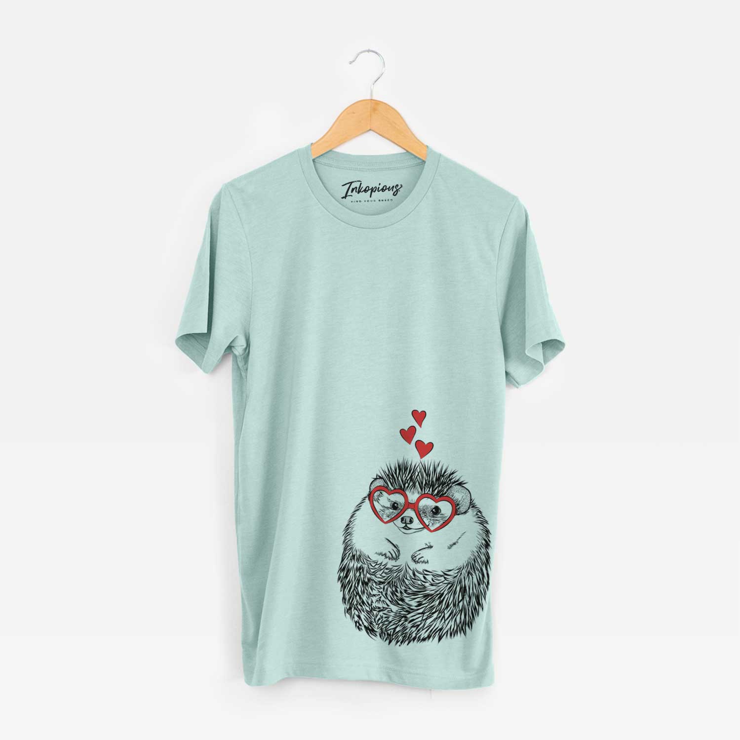 Hand-drawn sketch of Sid the Hedgehog wearing heart-shaped glasses on a Heather Sage Unisex crewneck