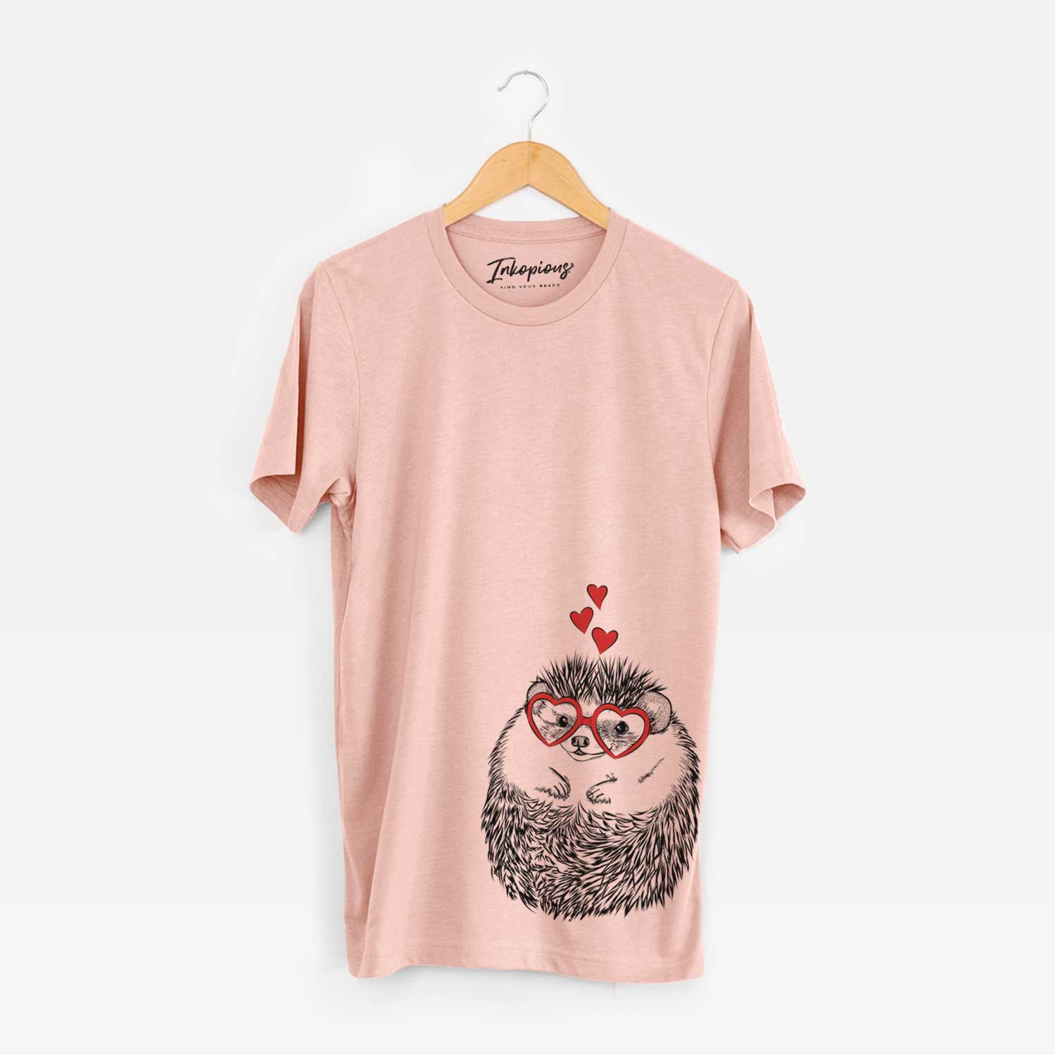 Hand-drawn sketch of Sid the Hedgehog wearing heart-shaped glasses on a Peach Unisex crewneck