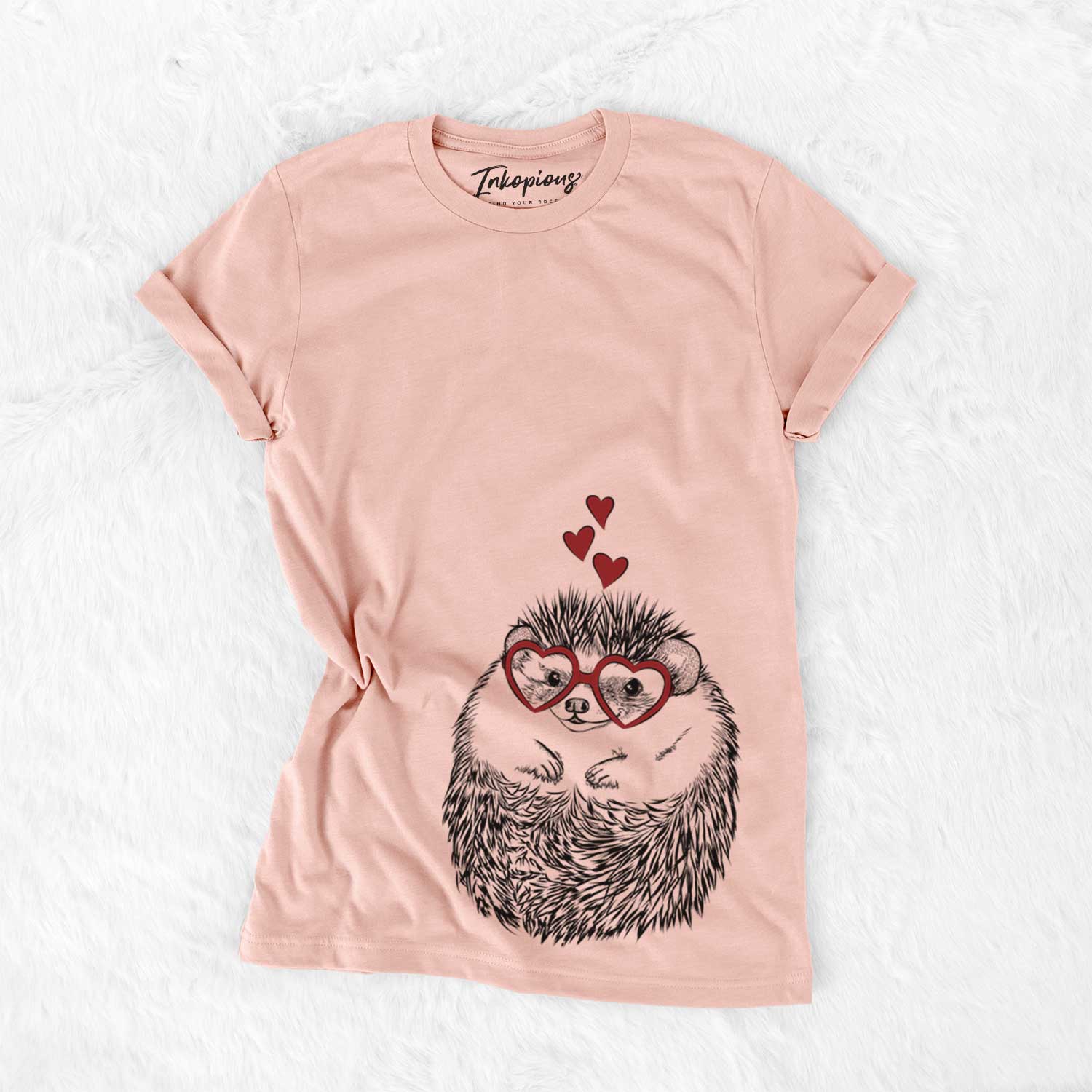 Hand-drawn sketch of Sid the Hedgehog wearing heart-shaped glasses on a Peach Bella Canvas Unisex Crewneck