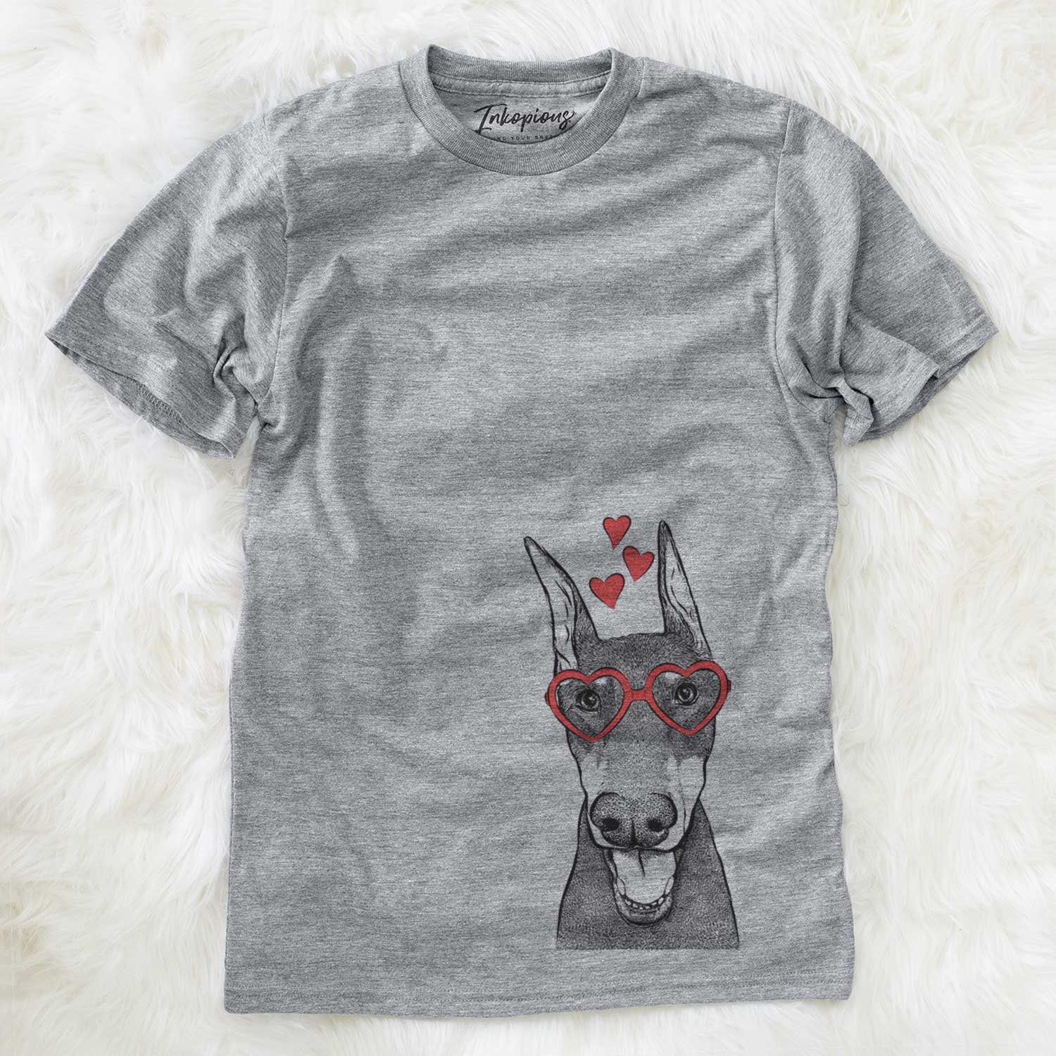Hand-drawn sketch of Sir Duke the Doberman Pinscher wearing heart-shaped glasses on a Grey Unisex crewneck