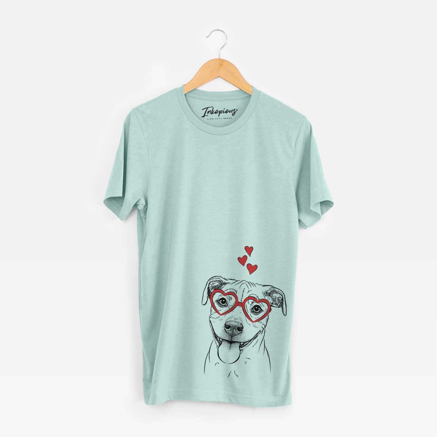Hand-drawn sketch of Skye the Pitweiler wearing heart-shaped glasses on a Heather Sage Unisex crewneck