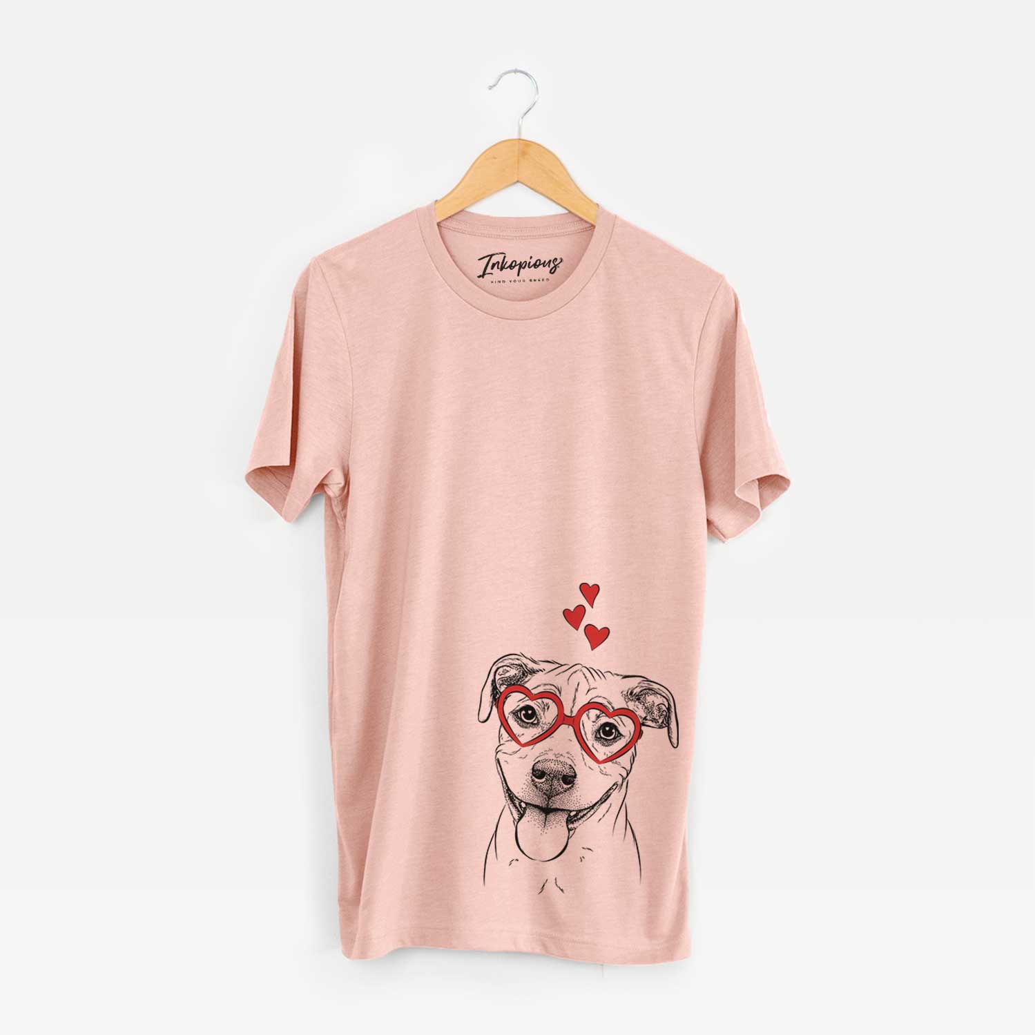 Hand-drawn sketch of Skye the Pitweiler wearing heart-shaped glasses on a Peach Unisex crewneck