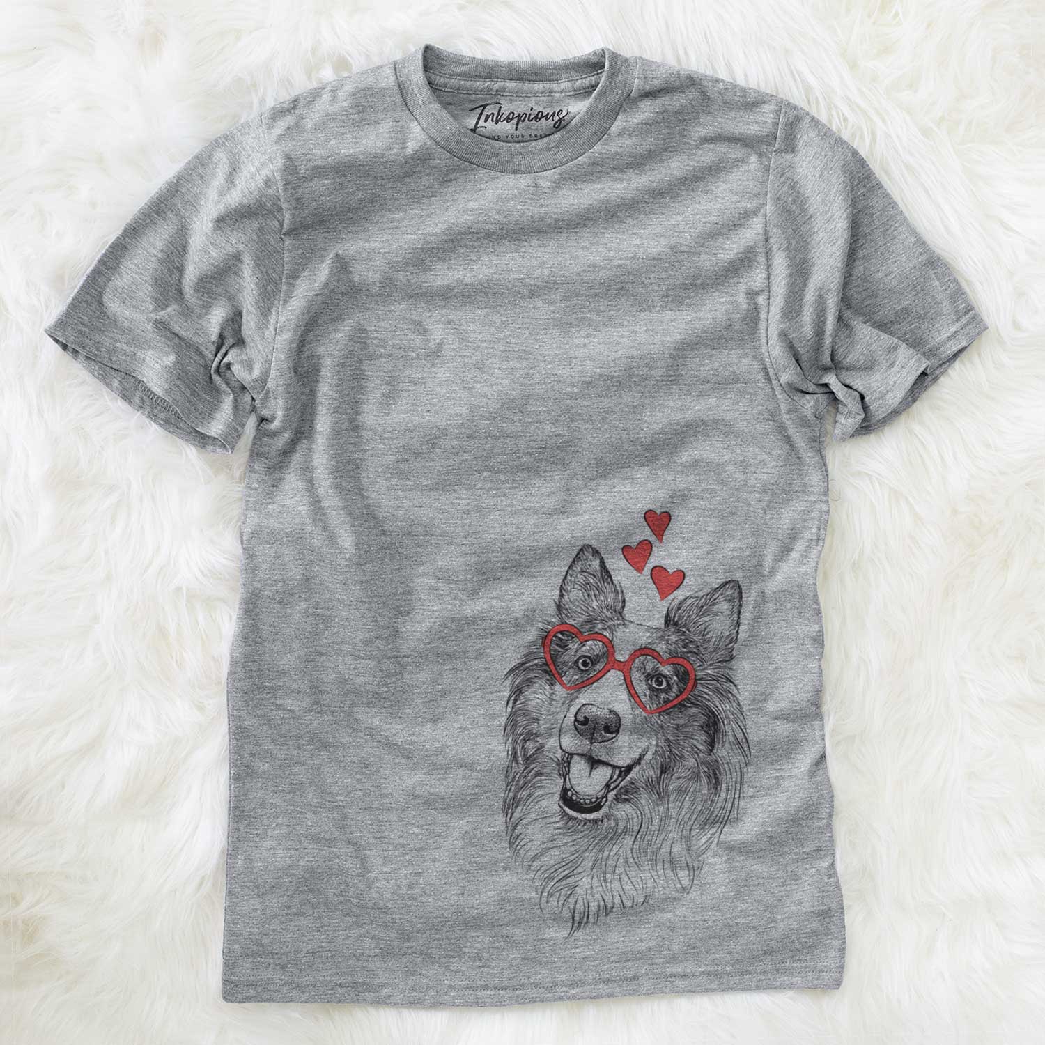 Hand-drawn sketch of Skylar the Shetland Sheepdog wearing heart-shaped glasses on a Grey Unisex crewneck