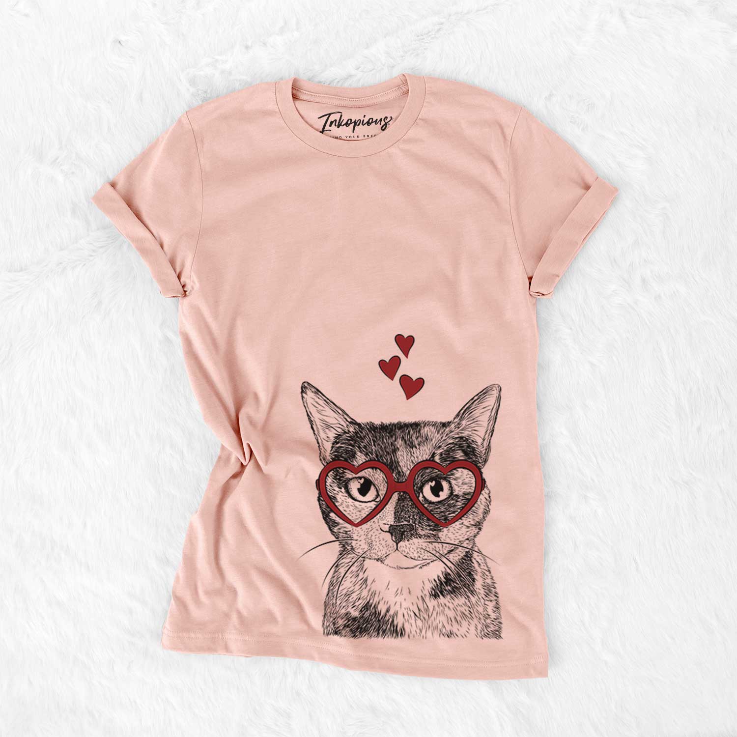 Hand-drawn sketch of Spooky Kitty the Tortoiseshell Cat wearing heart-shaped glasses on a Peach Bella Canvas Unisex Crewneck