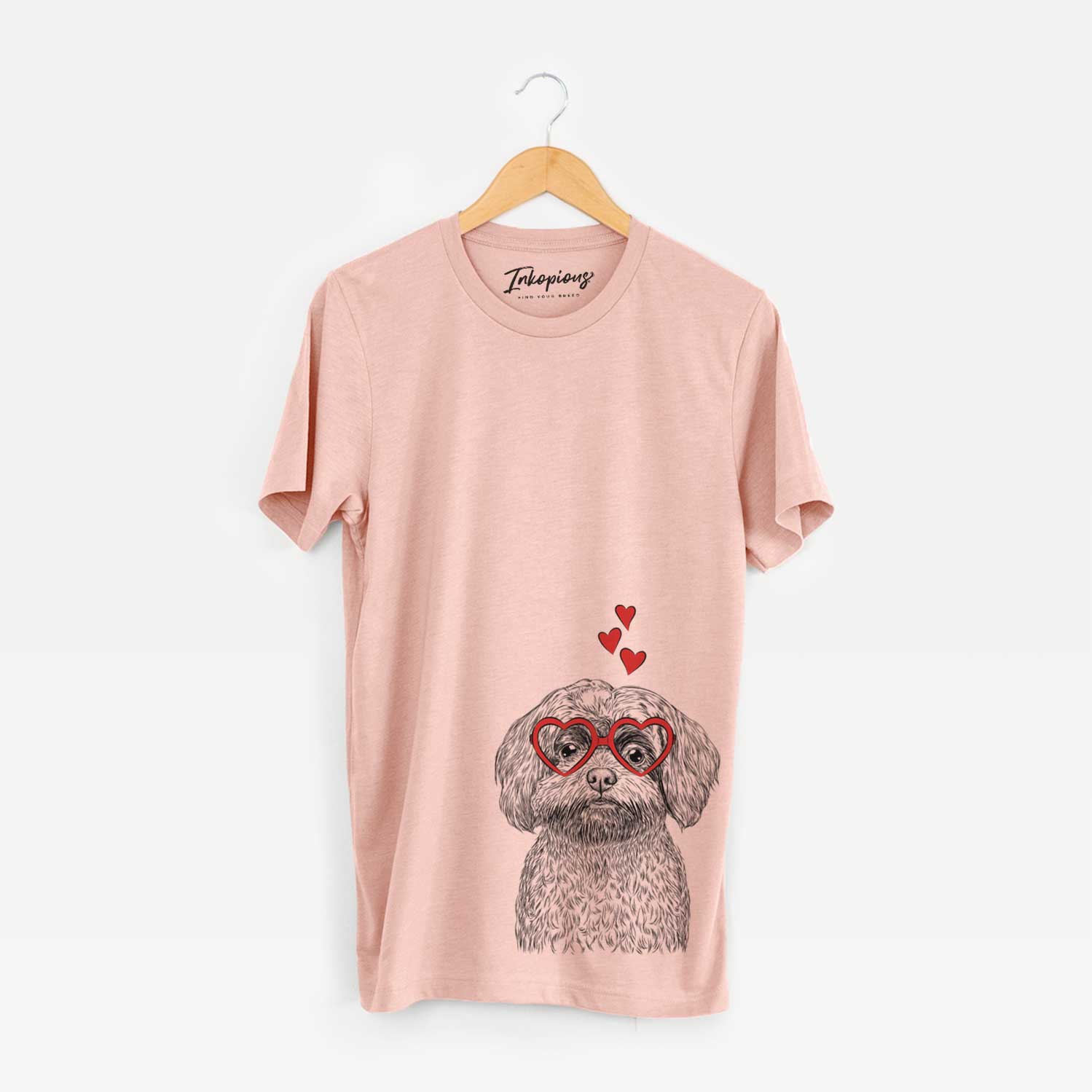 Hand-drawn sketch of Stella the Shih Tzu Mix wearing heart-shaped glasses on a Peach Unisex crewneck