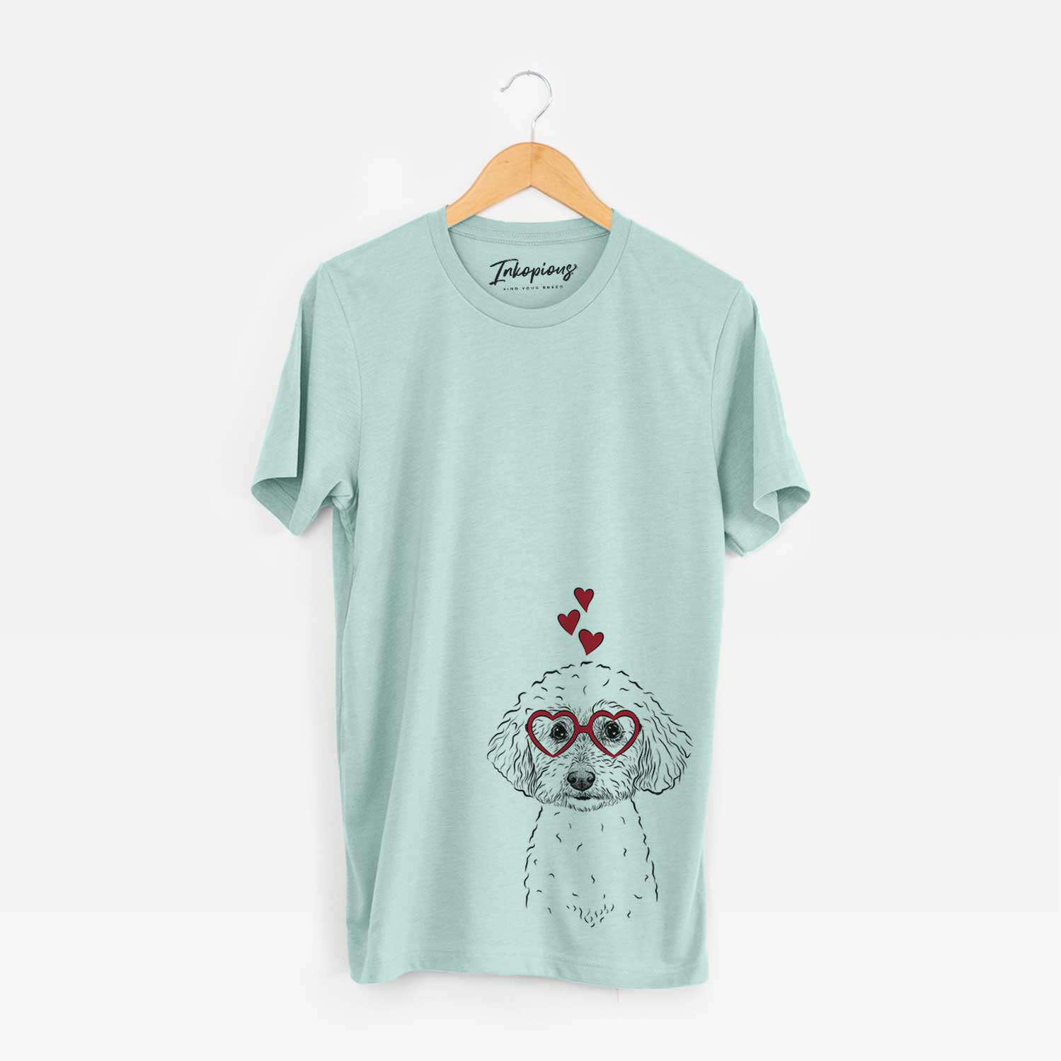 Hand-drawn sketch of Stitch the Bichonpoo wearing heart-shaped glasses on a Heather Sage Bella Canvas Unisex Crewneck