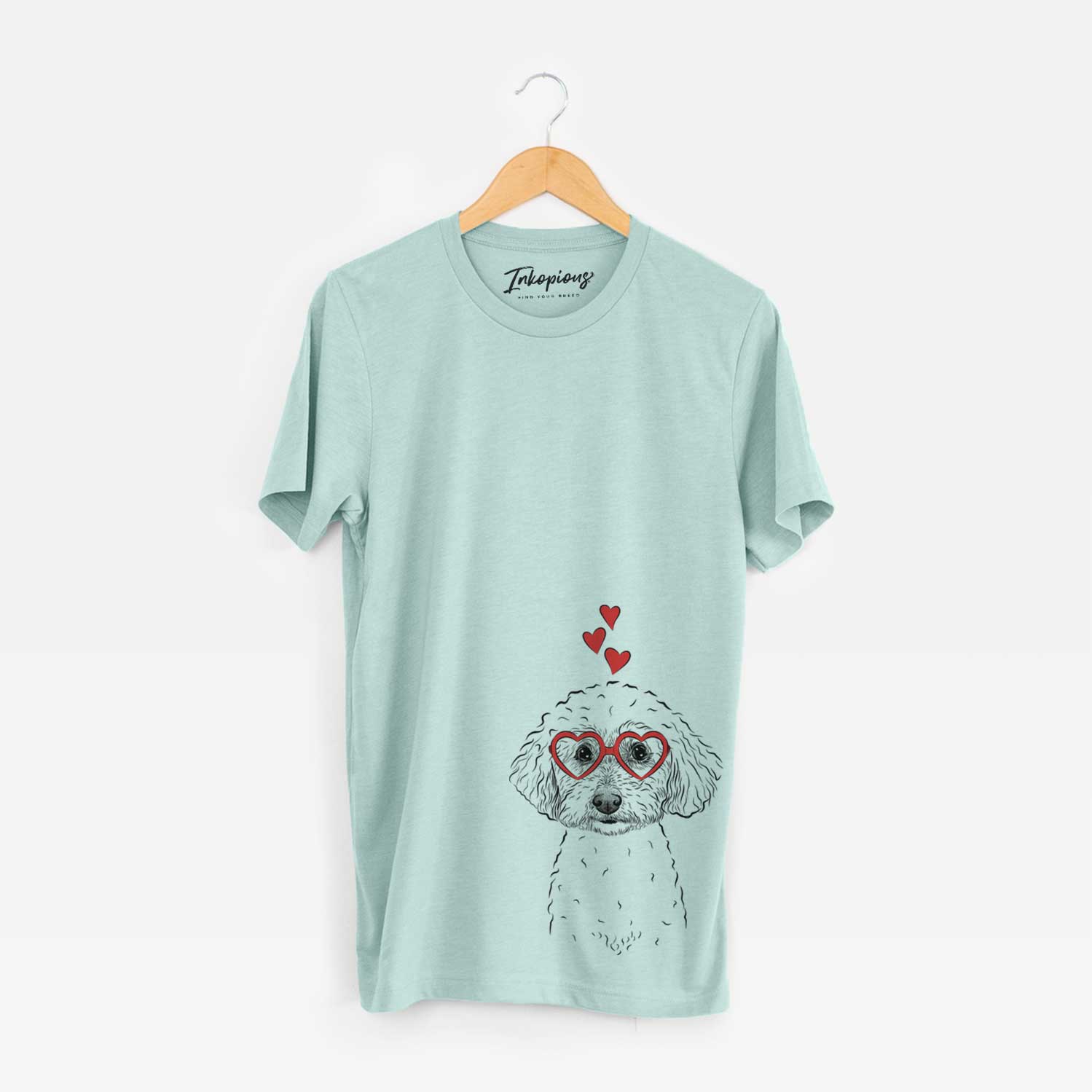 Hand-drawn sketch of Stitch the Bichonpoo wearing heart-shaped glasses on a Heather Sage Unisex crewneck