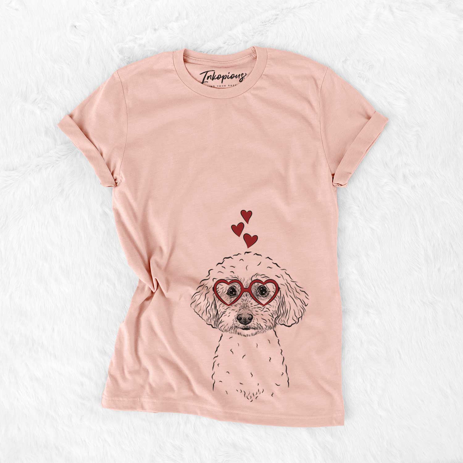 Hand-drawn sketch of Stitch the Bichonpoo wearing heart-shaped glasses on a Peach Bella Canvas Unisex Crewneck