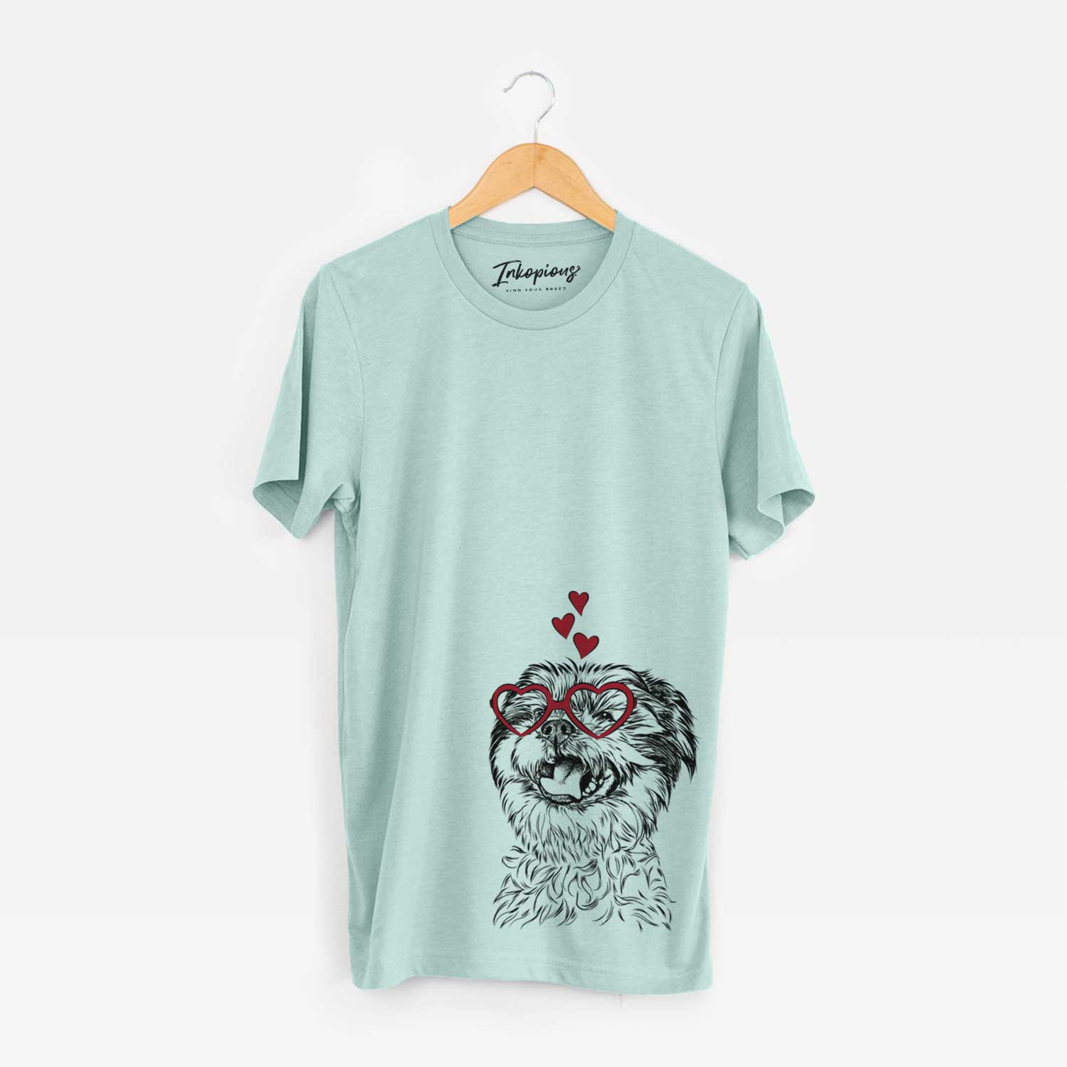 Hand-drawn sketch of Sugar the Malshi wearing heart-shaped glasses on a Heather Sage Bella Canvas Unisex Crewneck