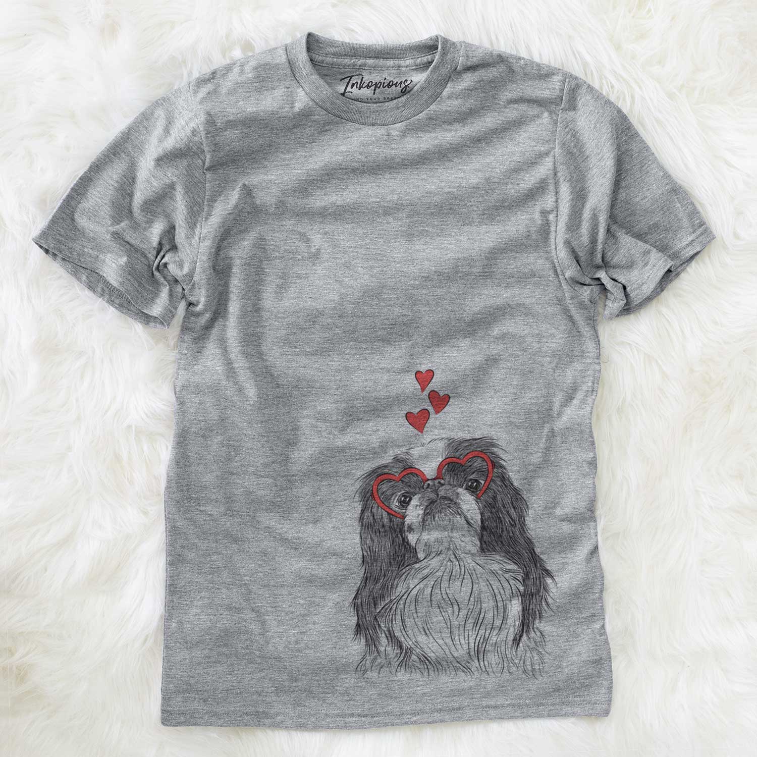 Hand-drawn sketch of Suki the Japanese Chin wearing heart-shaped glasses on a Grey Unisex crewneck