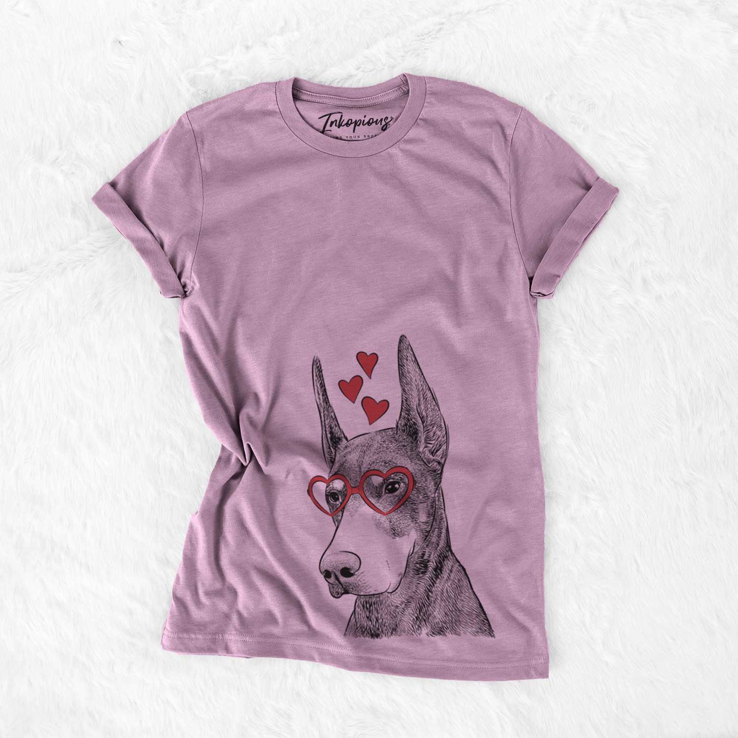 Hand-drawn sketch of Sunny the Doberman Pinscher wearing heart-shaped glasses on an Orchid Bella Canvas Unisex Crewneck