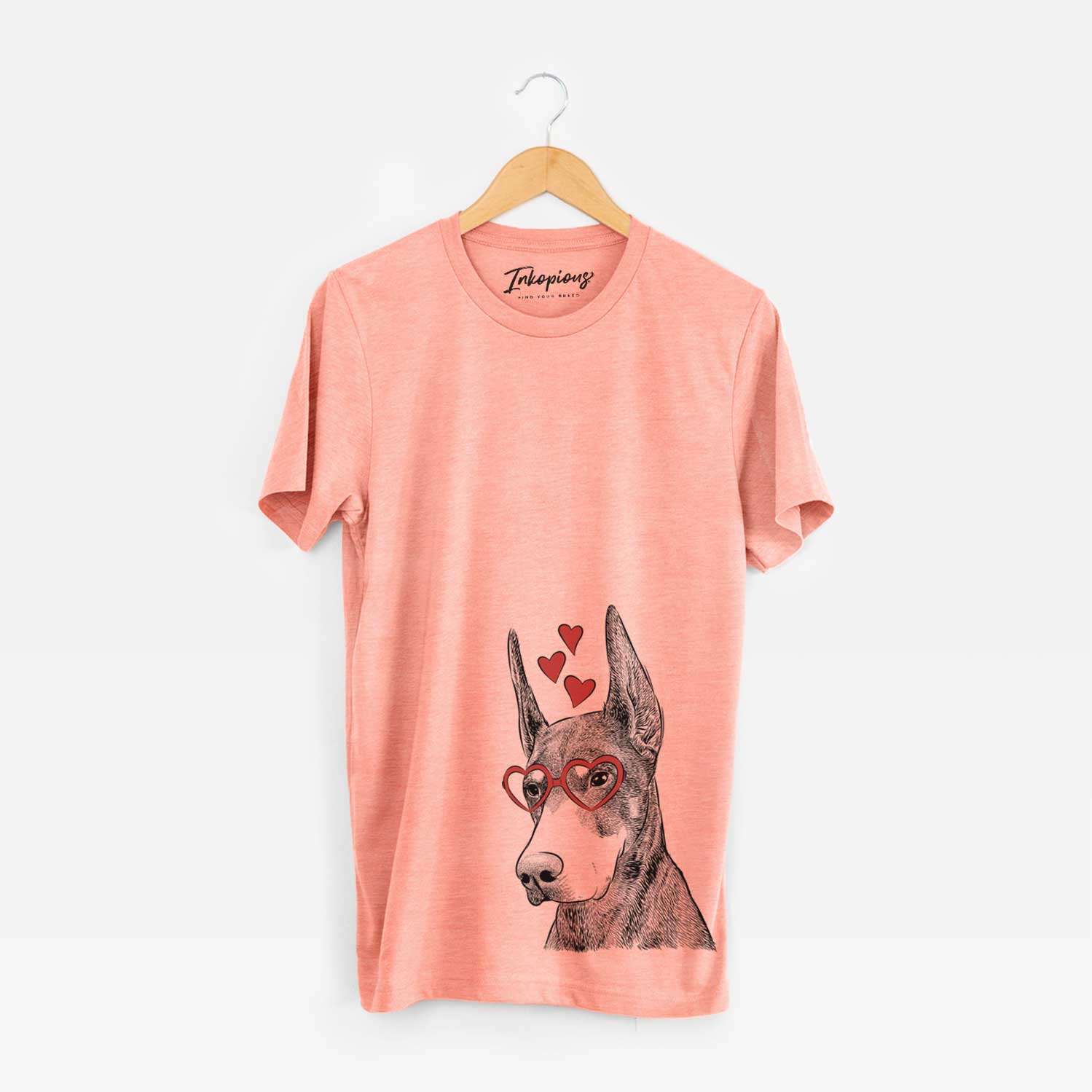 Hand-drawn sketch of Sunny the Doberman Pinscher wearing heart-shaped glasses on a Sunset Unisex crewneck