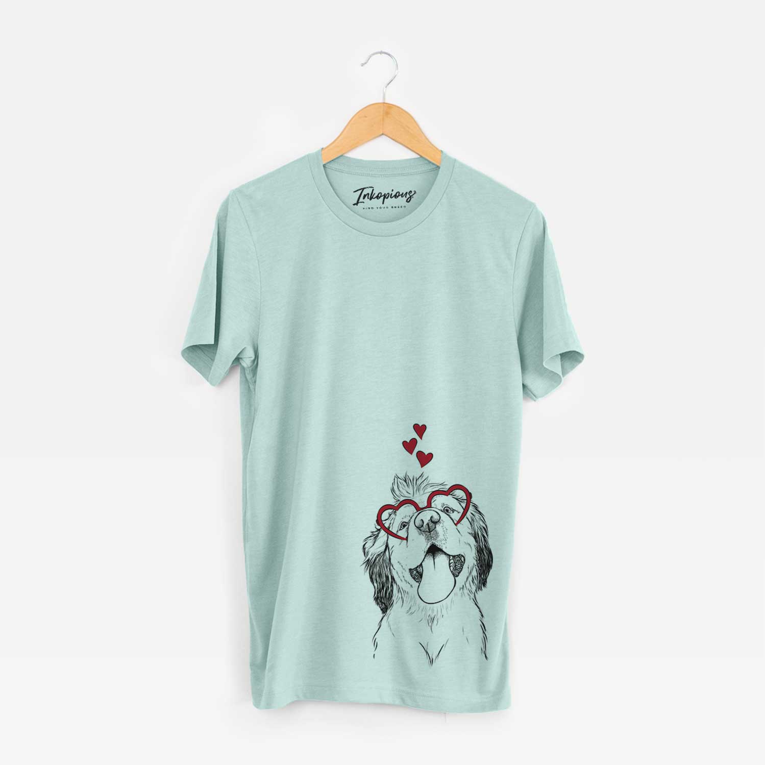 Hand-drawn sketch of Sven the Double Merle Spaniel Aussie Mix wearing heart-shaped glasses on a Heather Sage Bella Canvas Unisex Crewneck