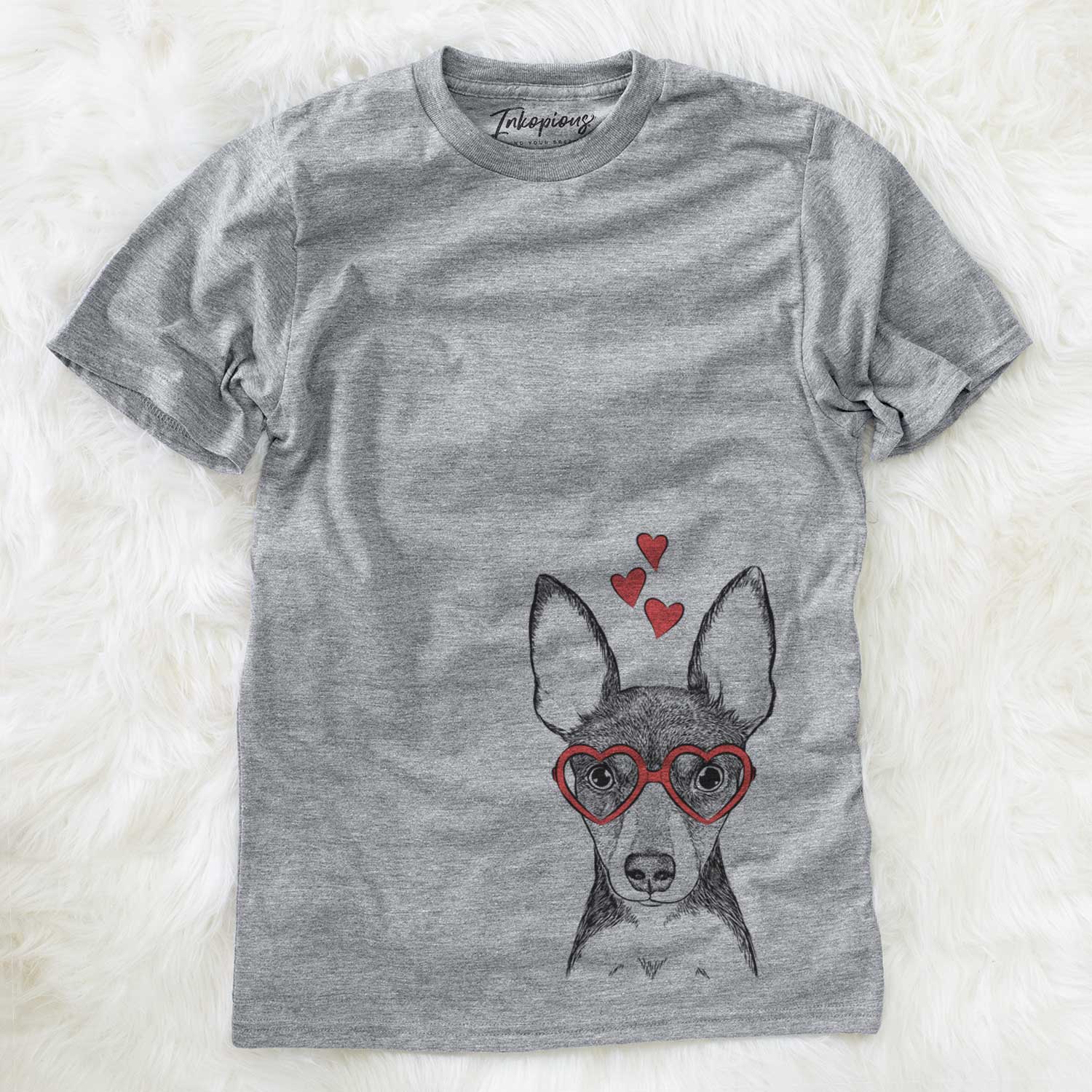 Hand-drawn sketch of Tiny the Toy Fox Terrier wearing heart-shaped glasses on a Grey Unisex crewneck