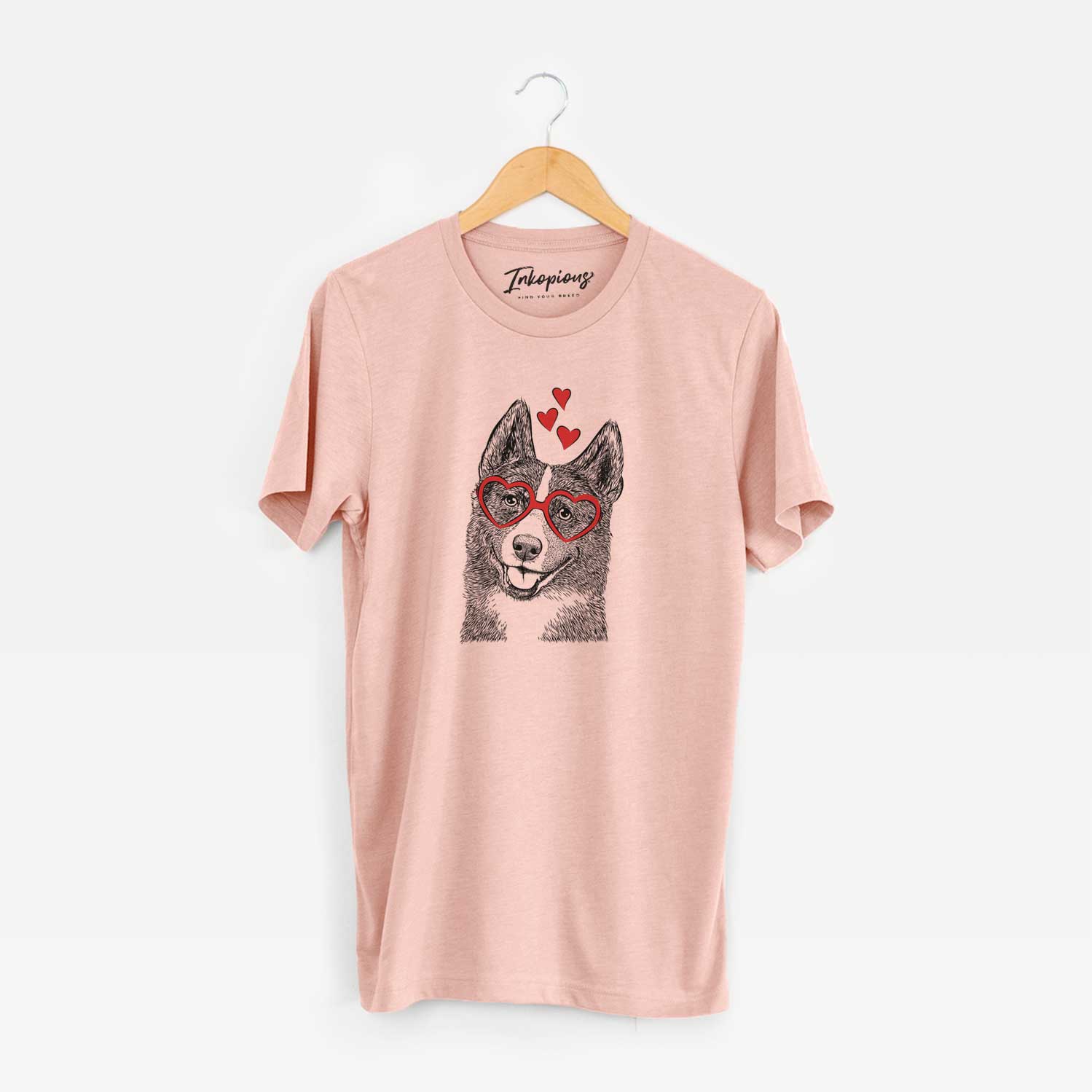 Hand-drawn sketch of Tosca the Karelian Bear Dog wearing heart-shaped glasses on a Peach Unisex crewneck