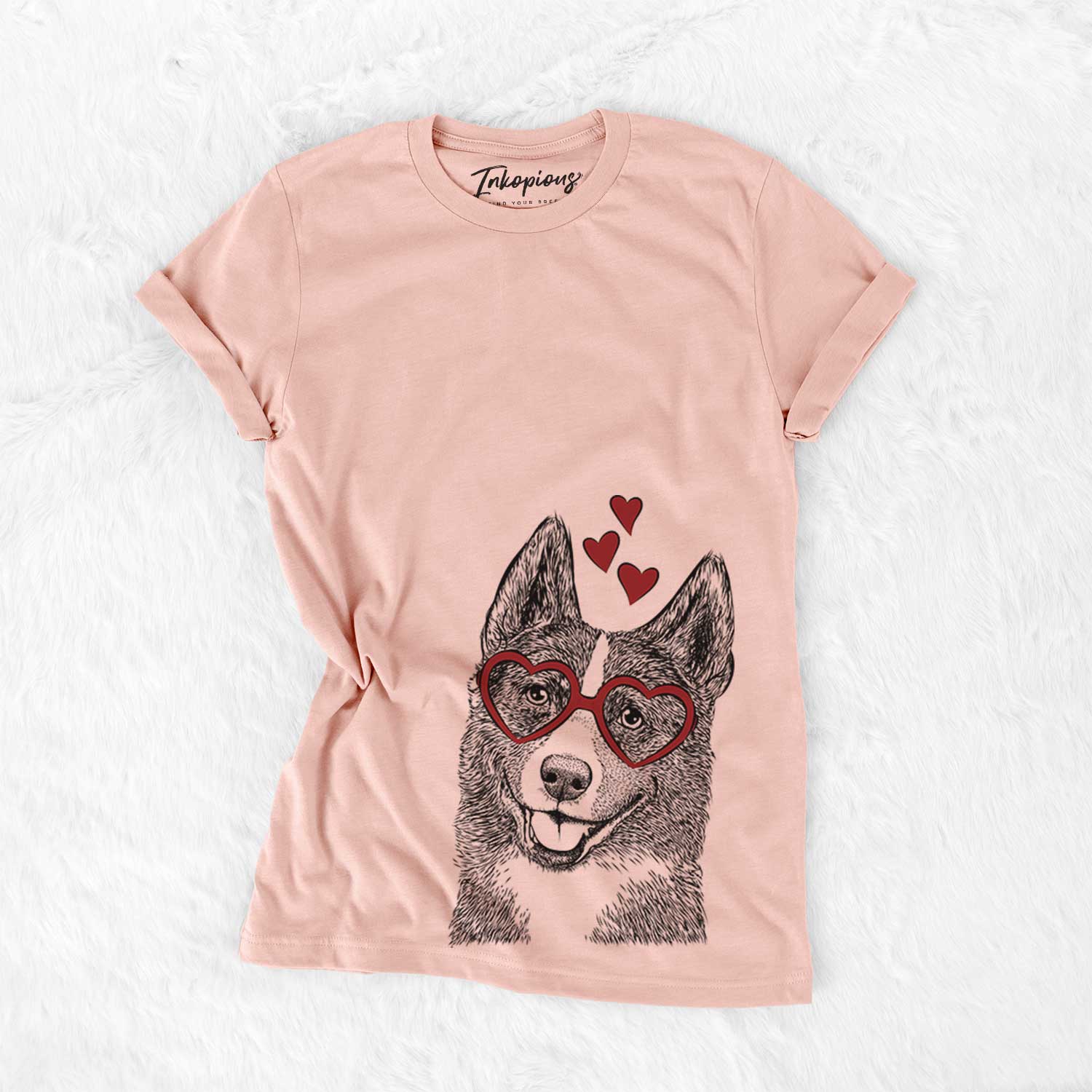Hand-drawn sketch of Tosca the Karelian Bear Dog wearing heart-shaped glasses on a Peach Bella Canvas Unisex Crewneck