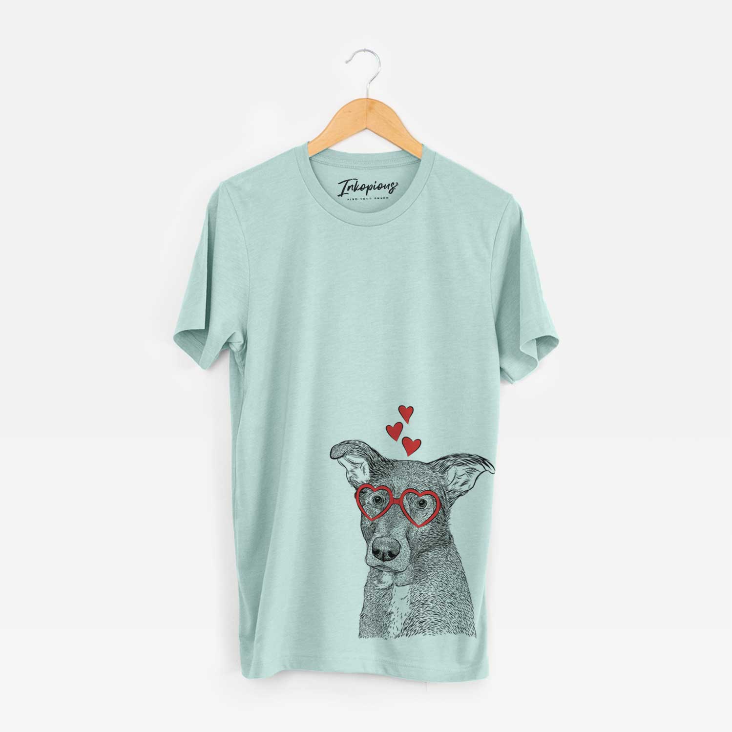 Hand-drawn sketch of Wilbur the Shepherd Mix wearing heart-shaped glasses on a Heather Sage Unisex crewneck