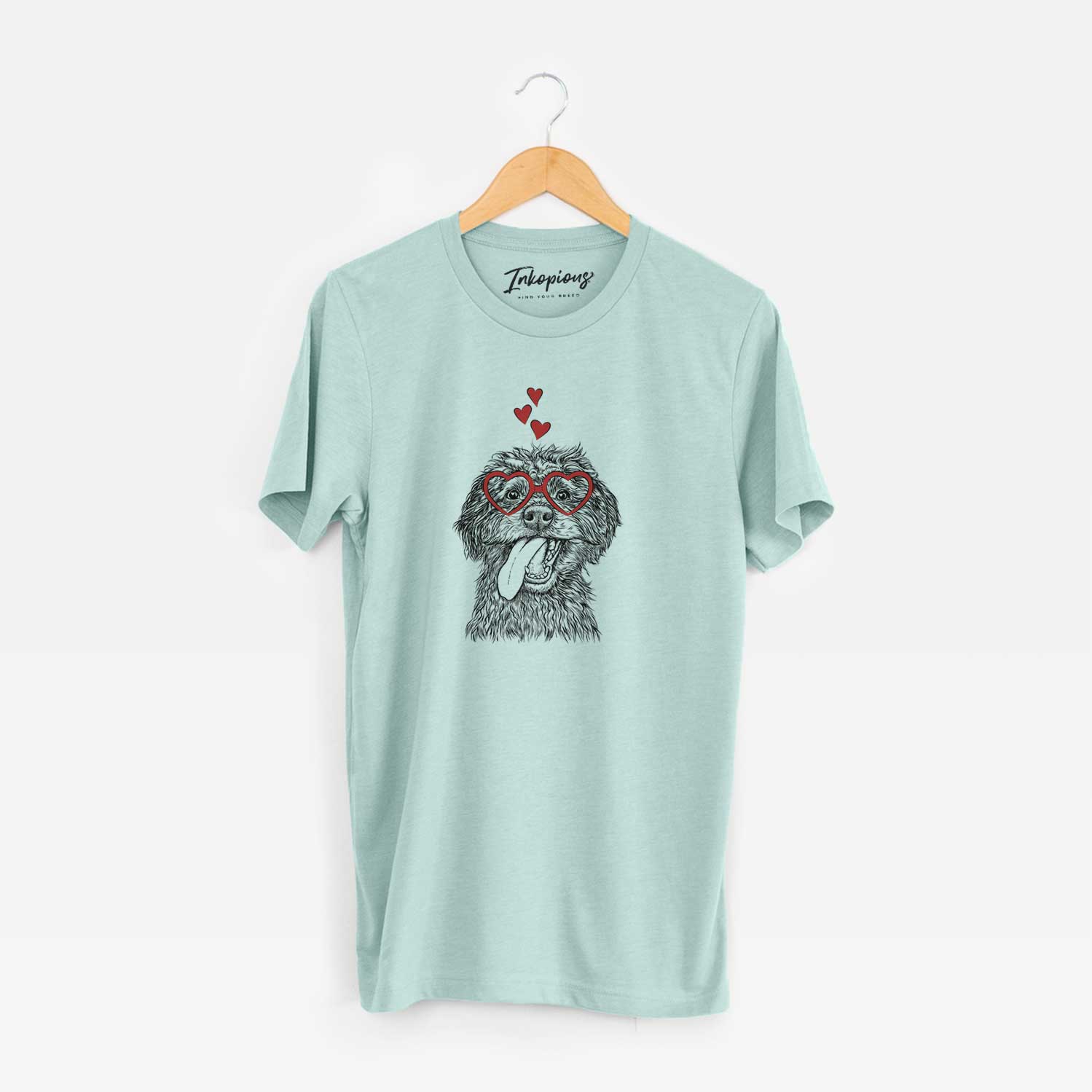 Hand-drawn sketch of Winnie the Mini Aussiedoodle wearing heart-shaped glasses on a Heather Sage Unisex crewneck