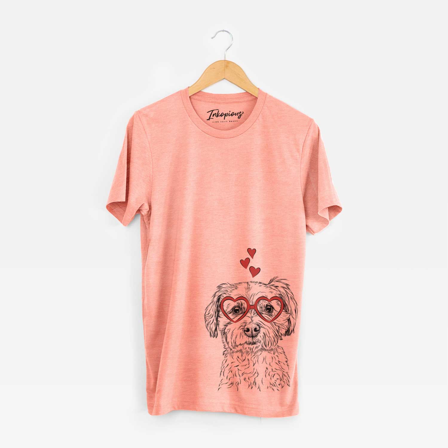 Hand-drawn sketch of Wyatt the Coton de Tulear wearing heart-shaped glasses on a Sunset Unisex crewneck