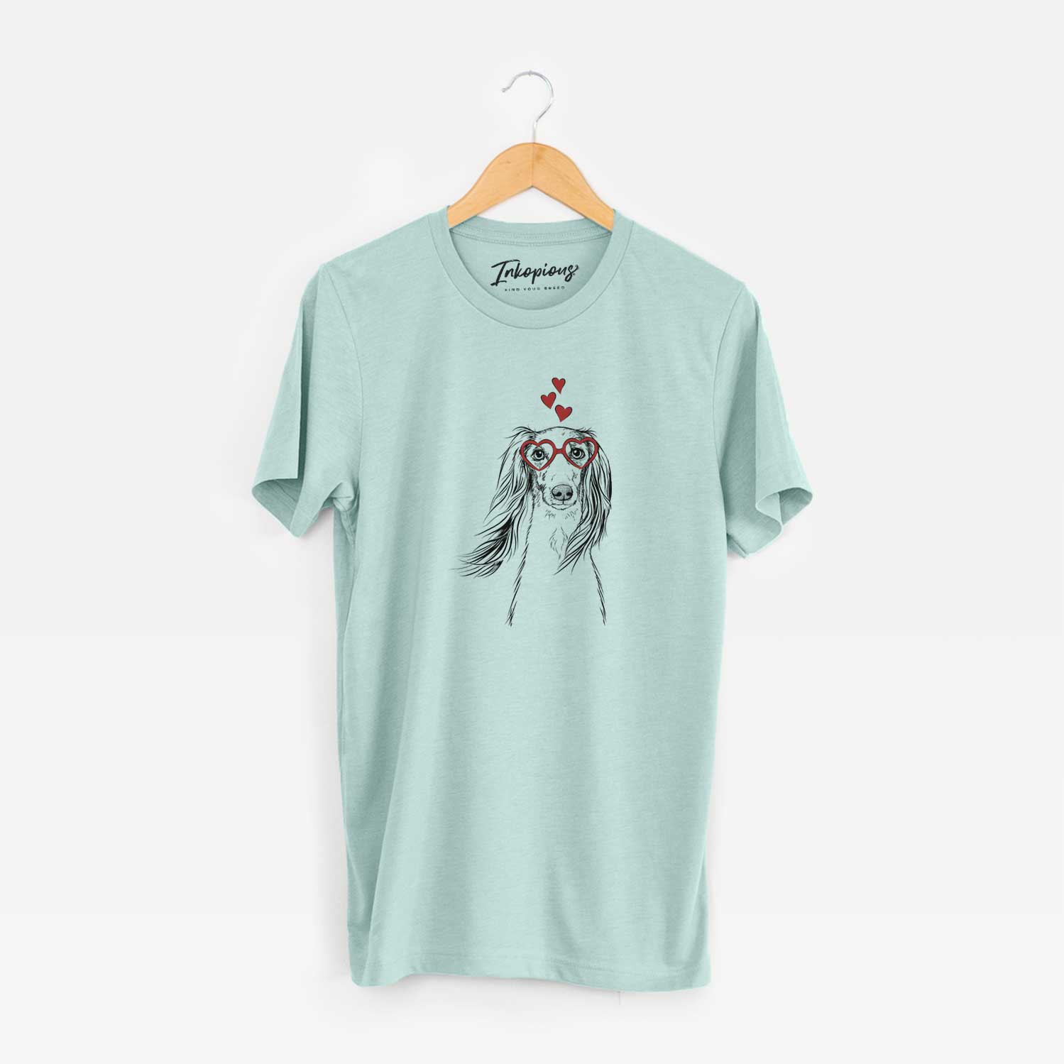 Hand-drawn sketch of Zahra the Saluki wearing heart-shaped glasses on a Heather Sage Unisex crewneck