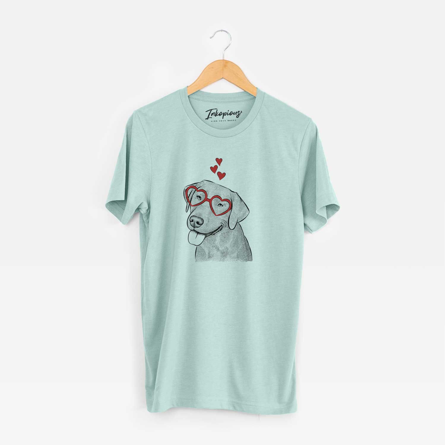 Hand-drawn sketch of Zeppelin the Black Labrador wearing heart-shaped glasses on a Heather Sage Unisex crewneck