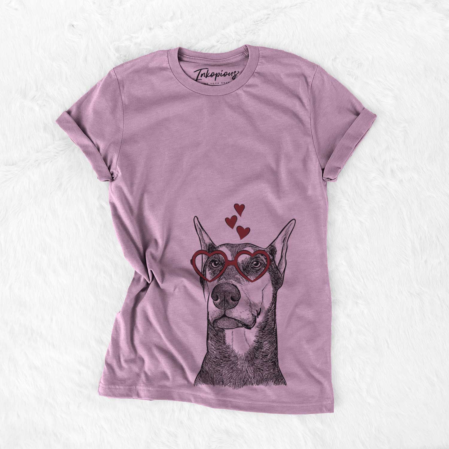 Hand-drawn sketch of Zeus the Doberman Pinscher wearing heart-shaped glasses on an Orchid Bella Canvas Unisex Crewneck