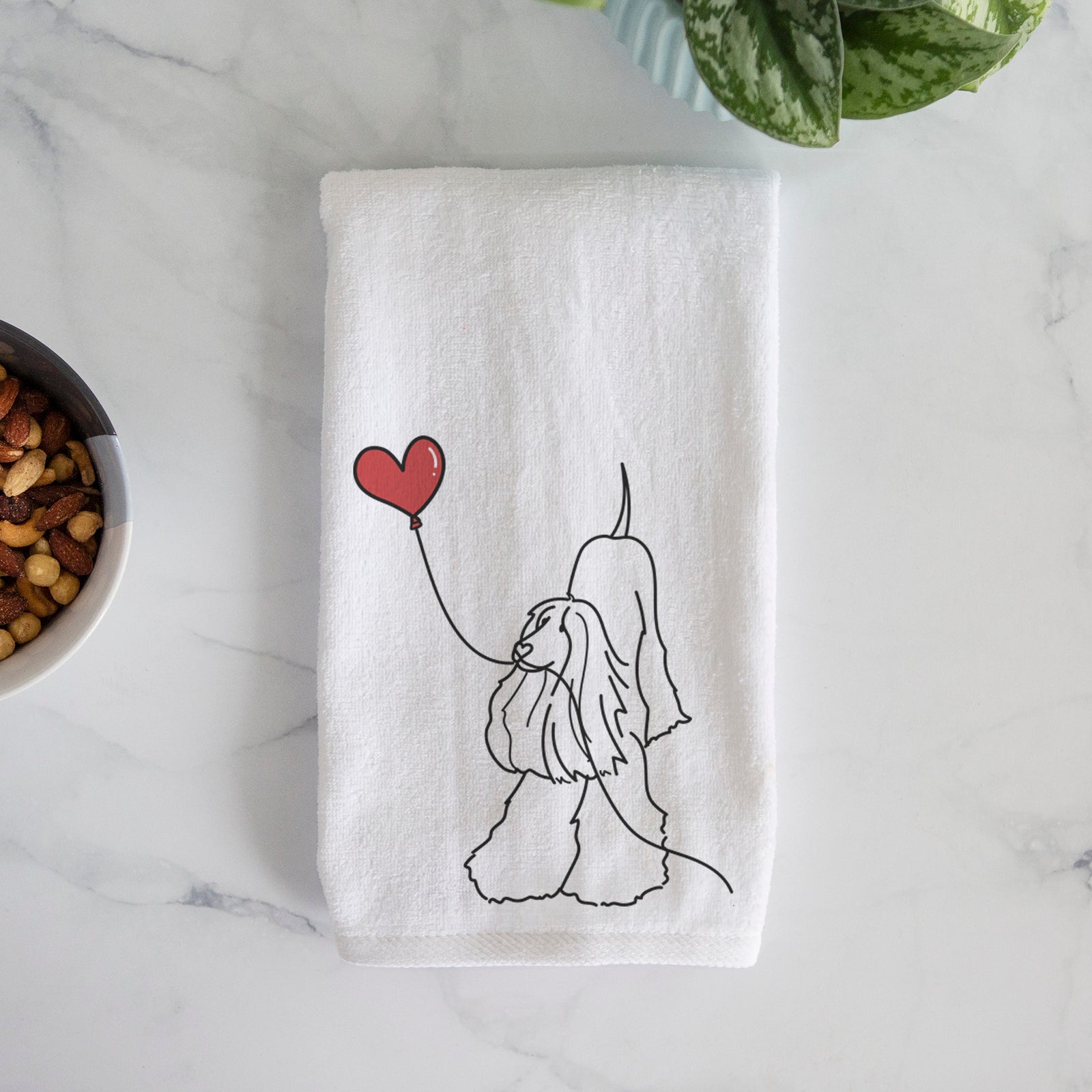 Minimalist line drawing of an Afghan Hound Heart String holding a heart balloon on a decorative hand towel