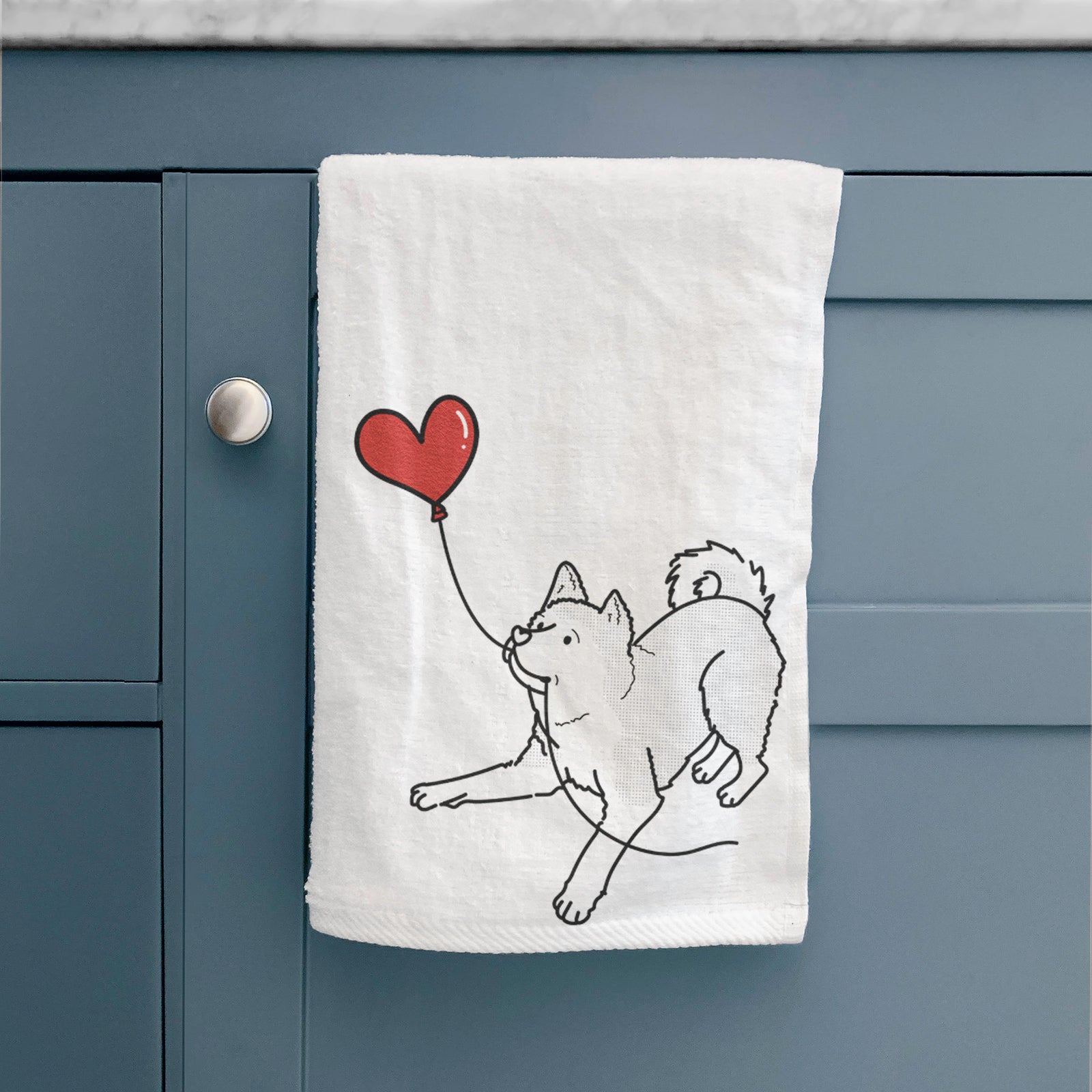 Minimalist line drawing of an Akita Heart String holding a heart balloon on a decorative hand towel