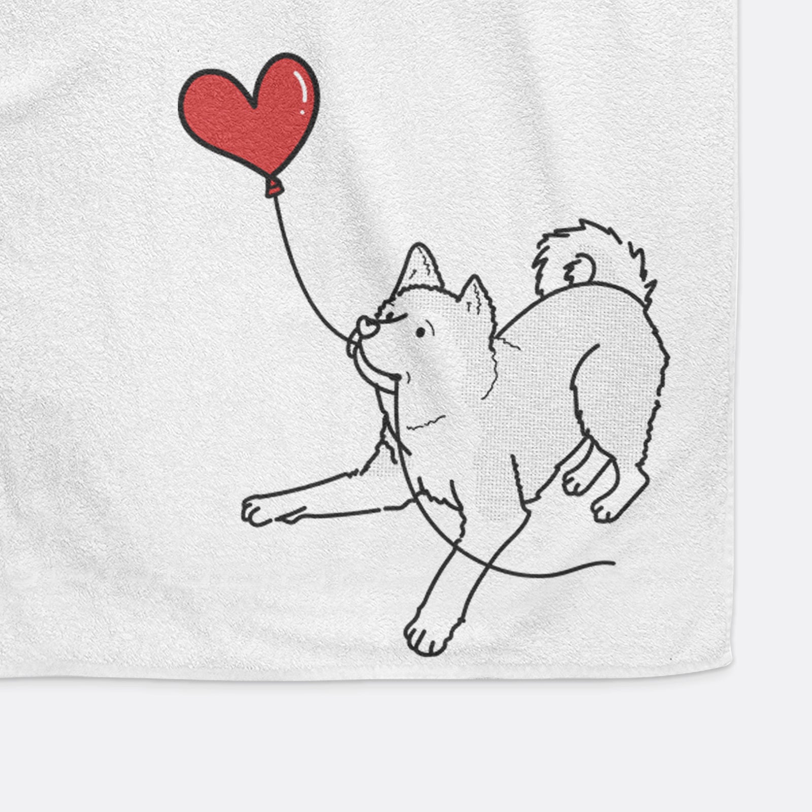 Minimalist line drawing of an Akita Heart String holding a heart balloon on a decorative hand towel