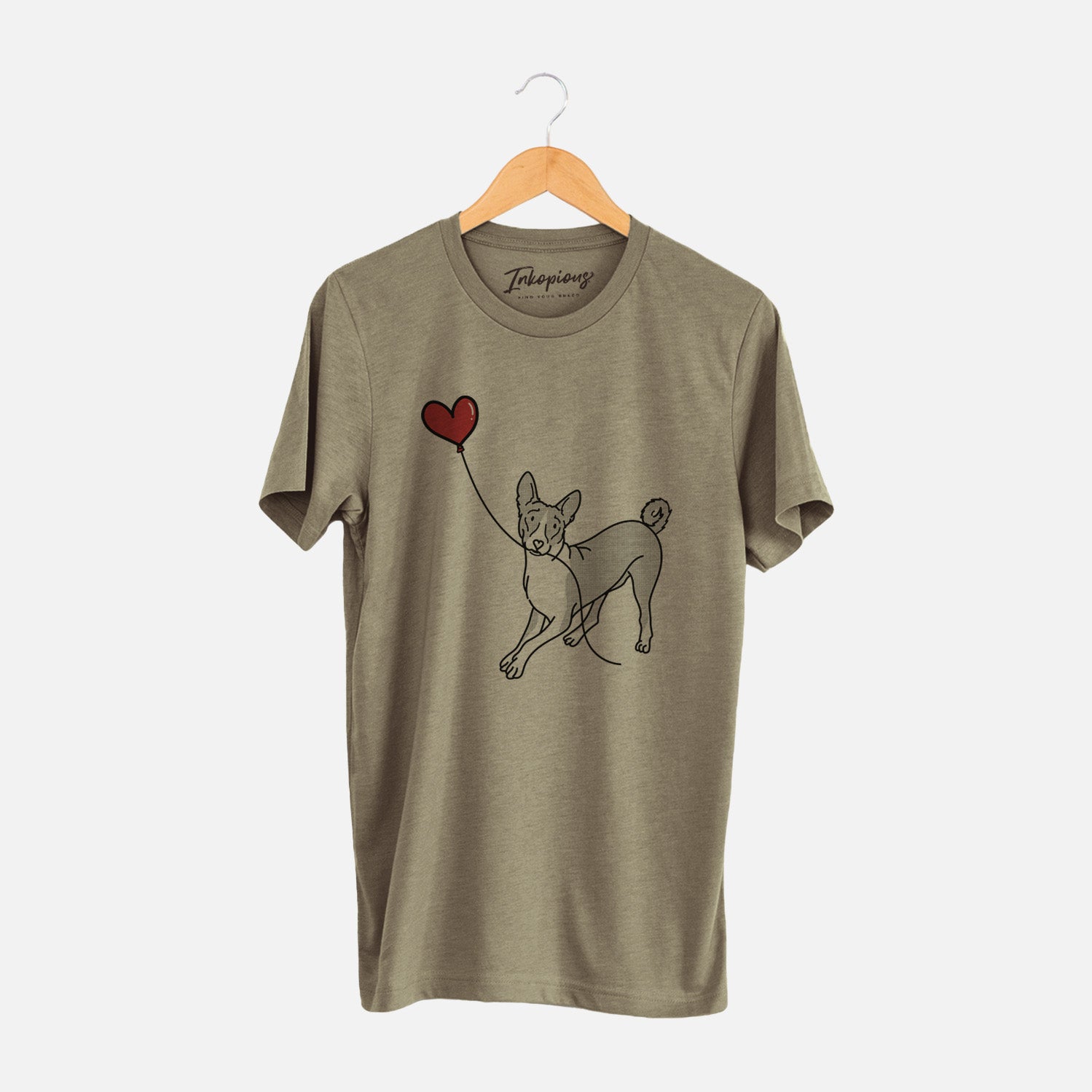 Minimalist line drawing of a Basenji Heart String holding a heart balloon on an Olive Unisex crewneck