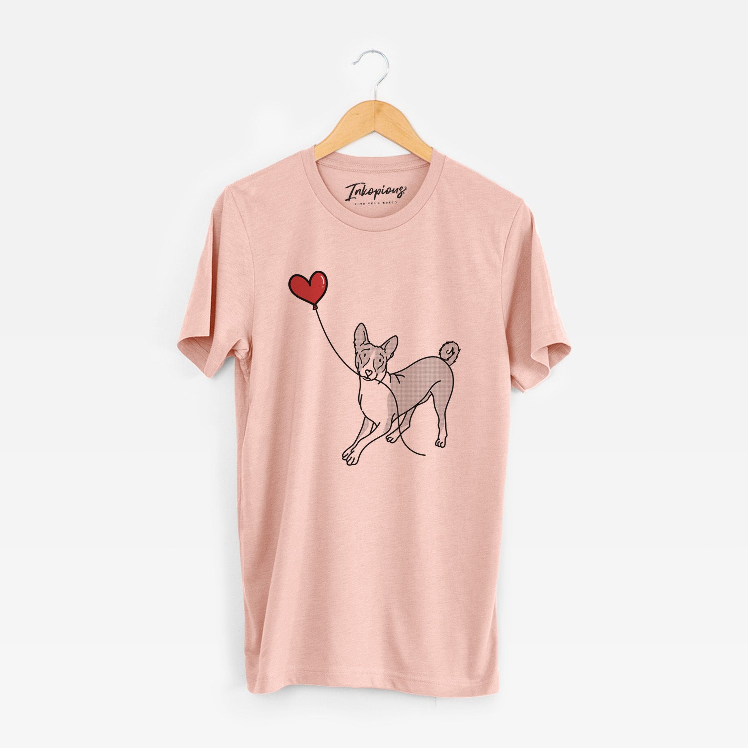 Minimalist line drawing of a Basenji Heart String holding a heart balloon on a Peach Unisex crewneck