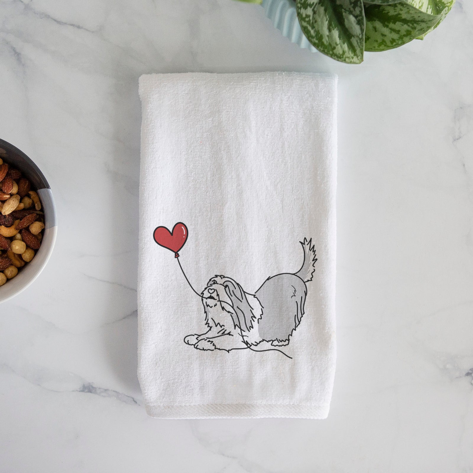 Minimalist line drawing of a Bearded Collie Heart String holding a heart balloon on a decorative hand towel