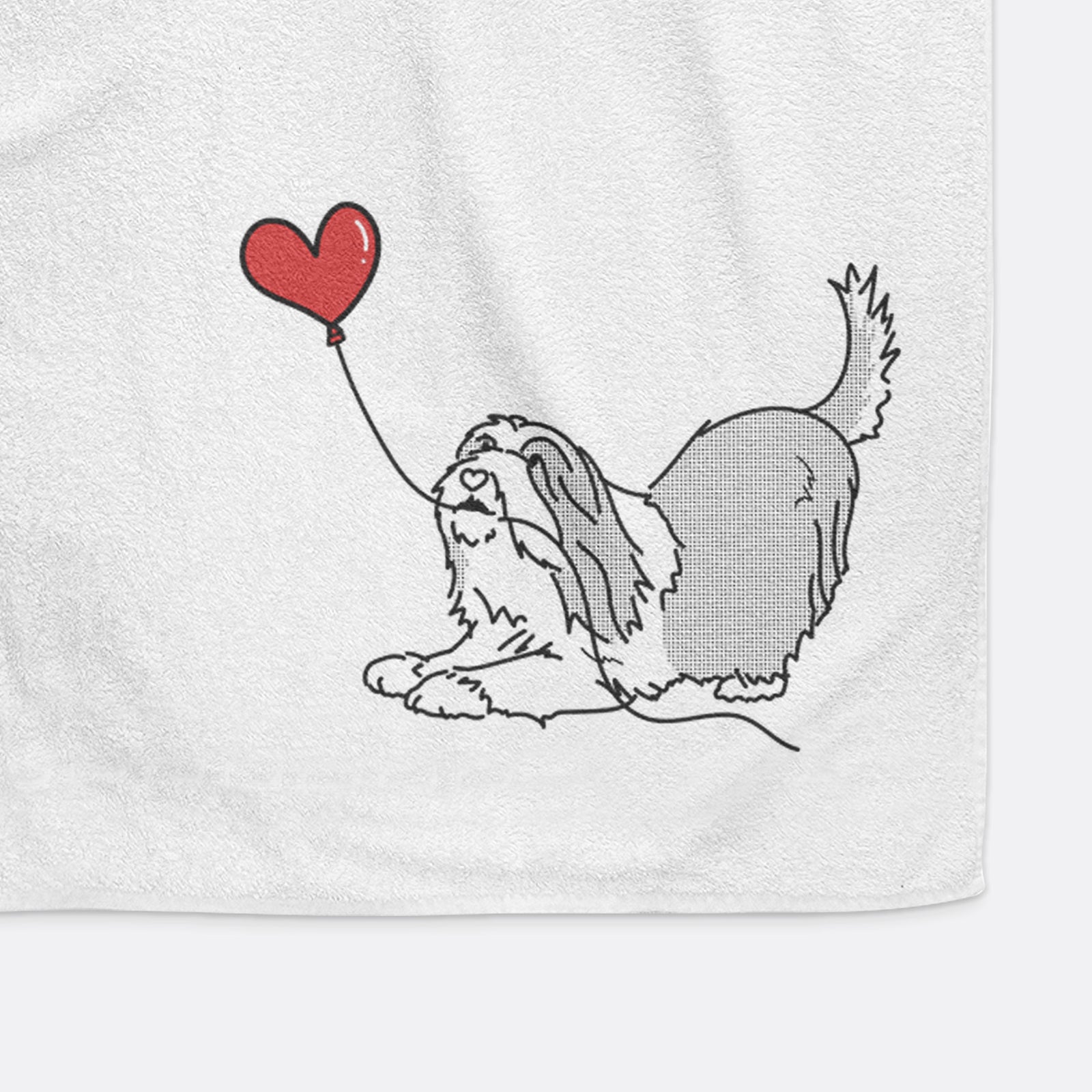 Minimalist line drawing of a Bearded Collie Heart String holding a heart balloon on a decorative hand towel