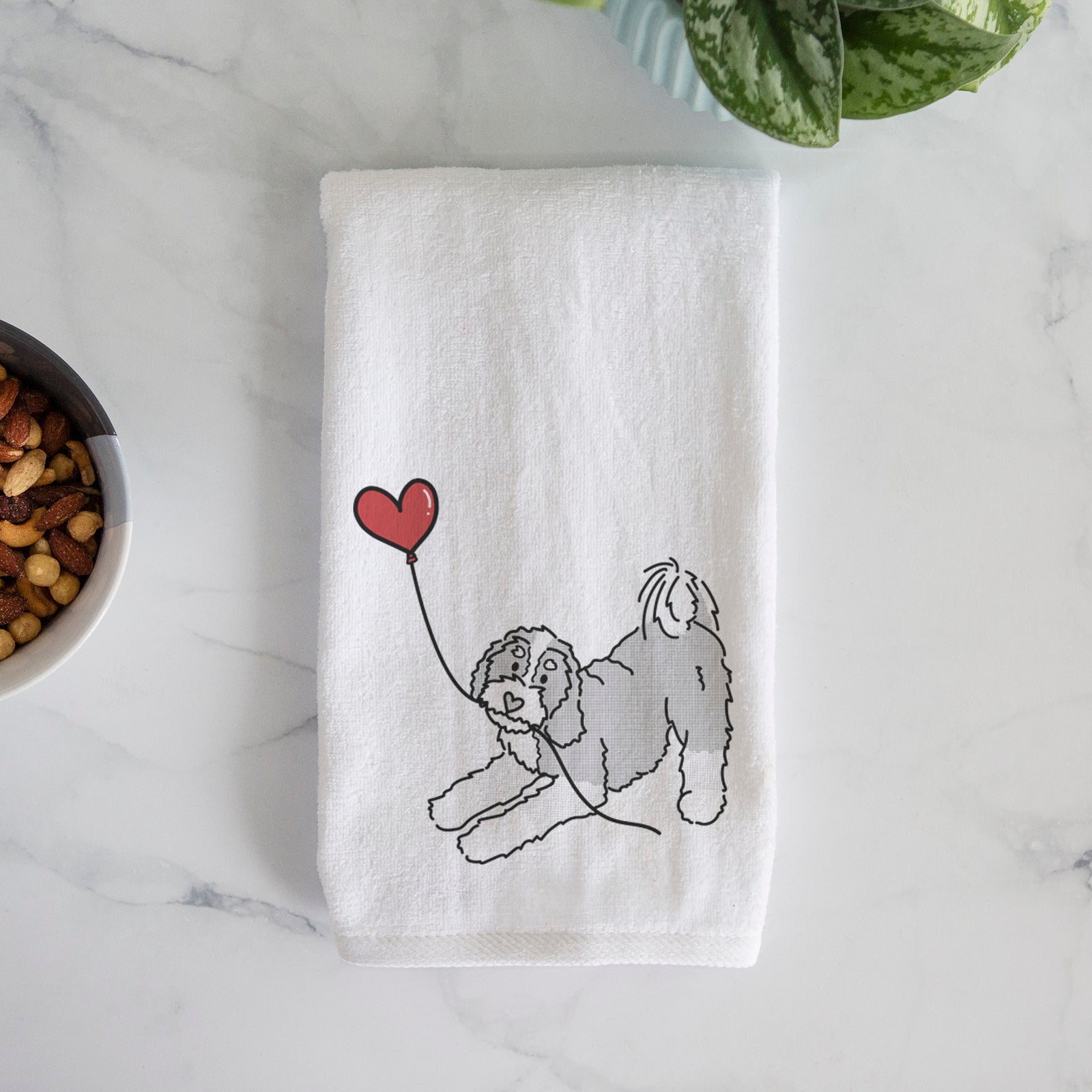 Minimalist line drawing of a Bernedoodle Heart String holding a heart balloon on a decorative hand towel