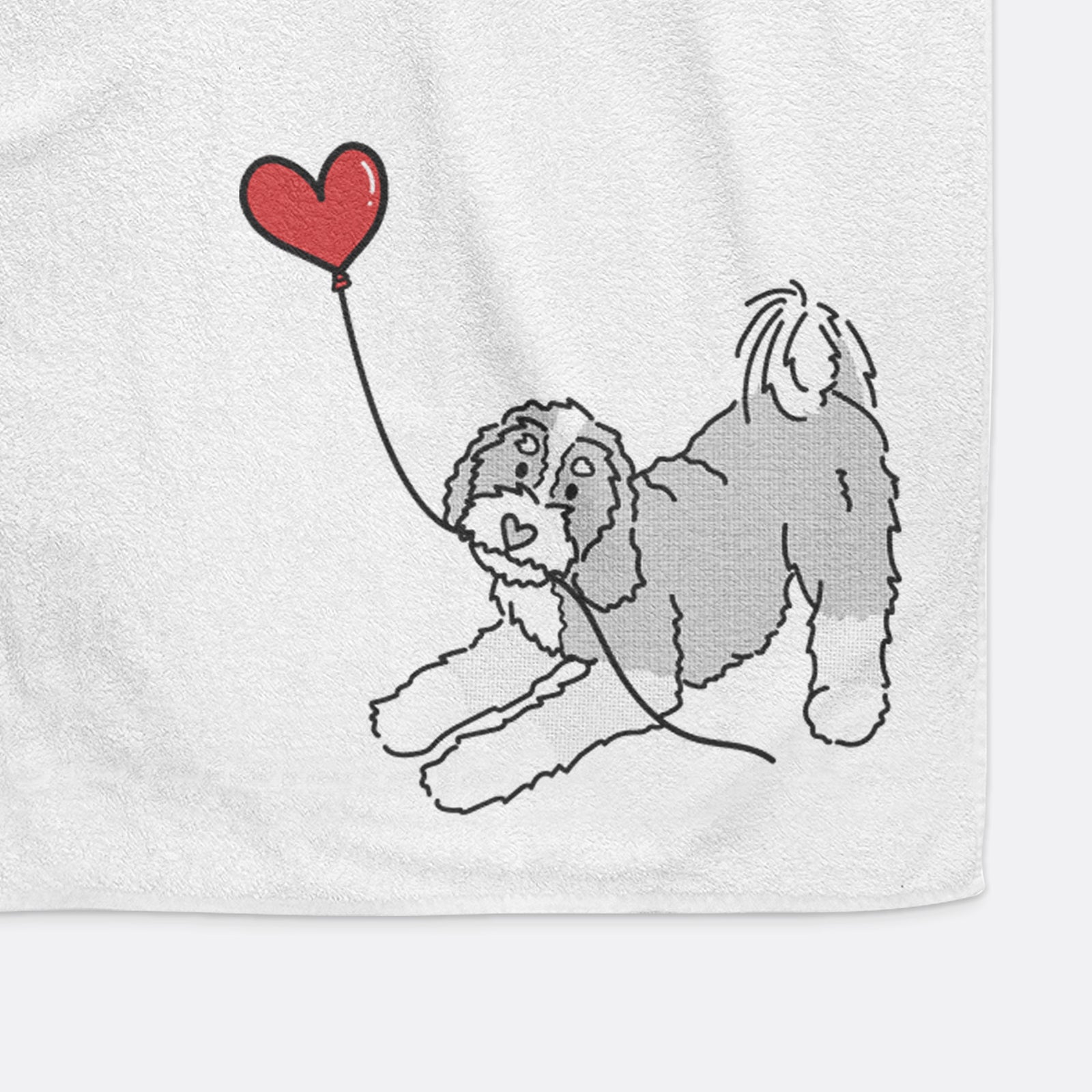 Minimalist line drawing of a Bernedoodle Heart String holding a heart balloon on a decorative hand towel